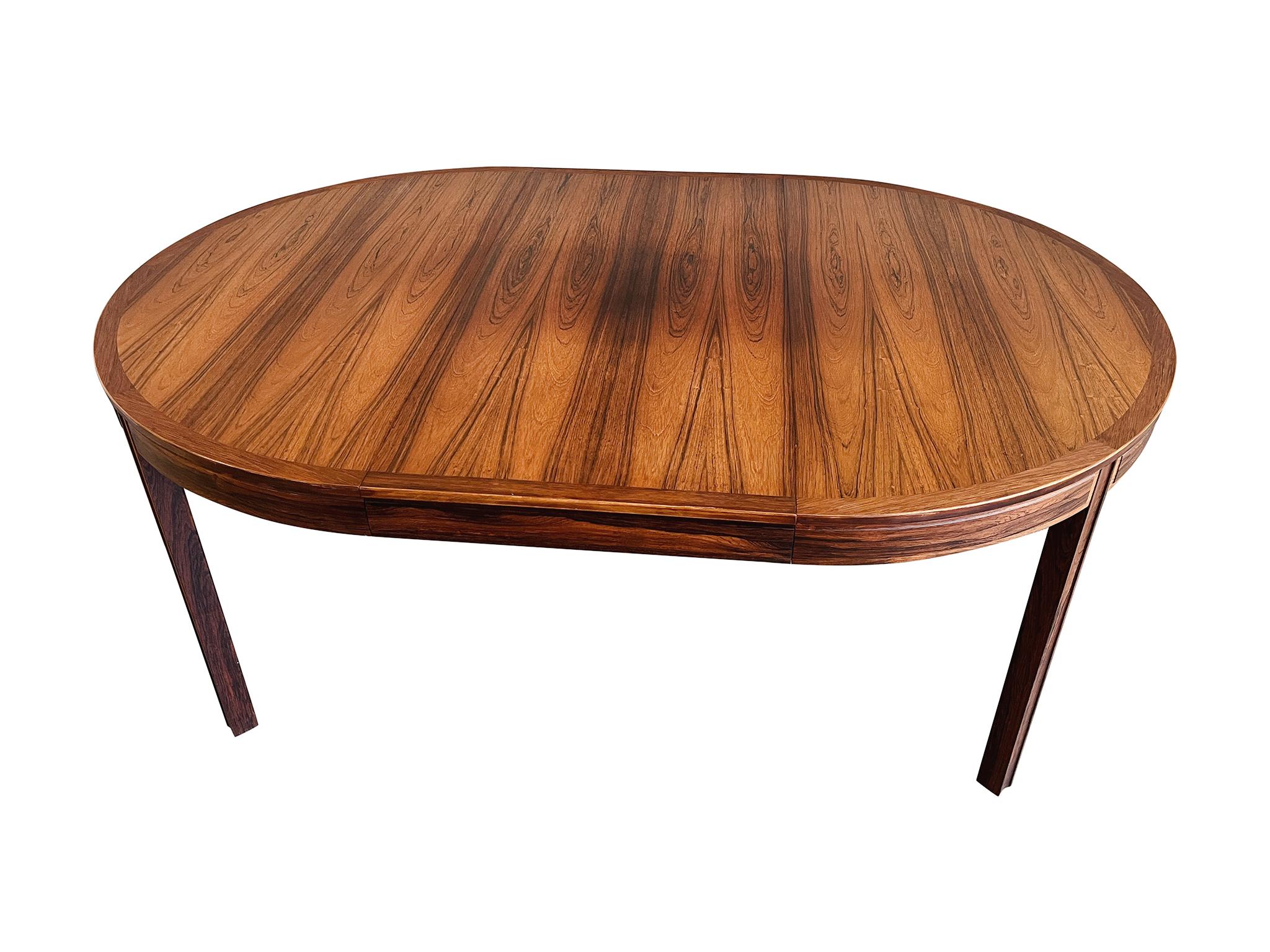 Designed by Swedish architect and designer Bertil Fridhagen for Bodafors, this rosewood table is perfect for modest spaces that can't always accommodate a large dining surface. It comes with two leaves, each measuring 21.5 inches wide. The table can