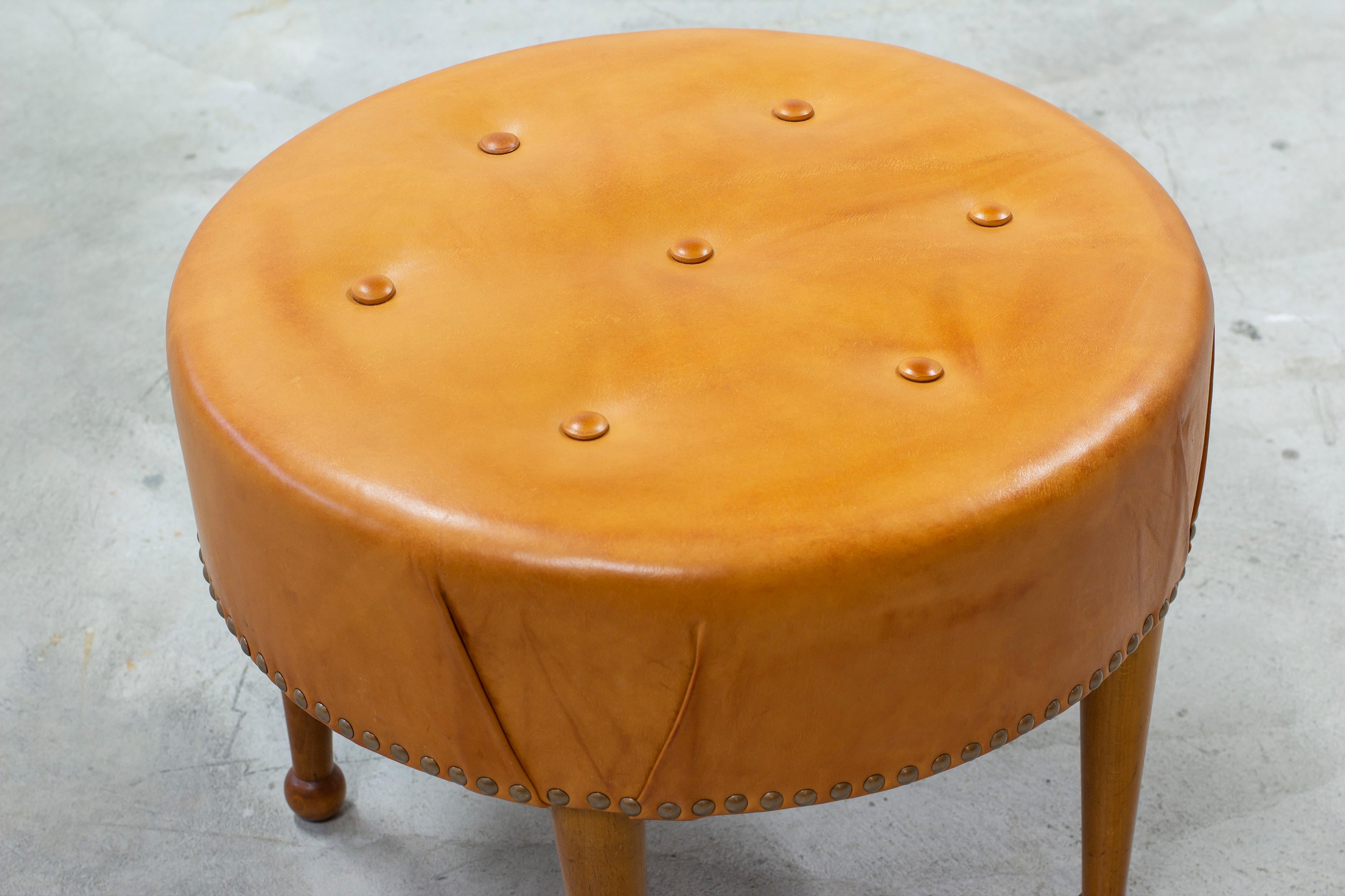 Mid-20th Century Swedish modern round leather tabouret in the style of Josef Frank, 1940s