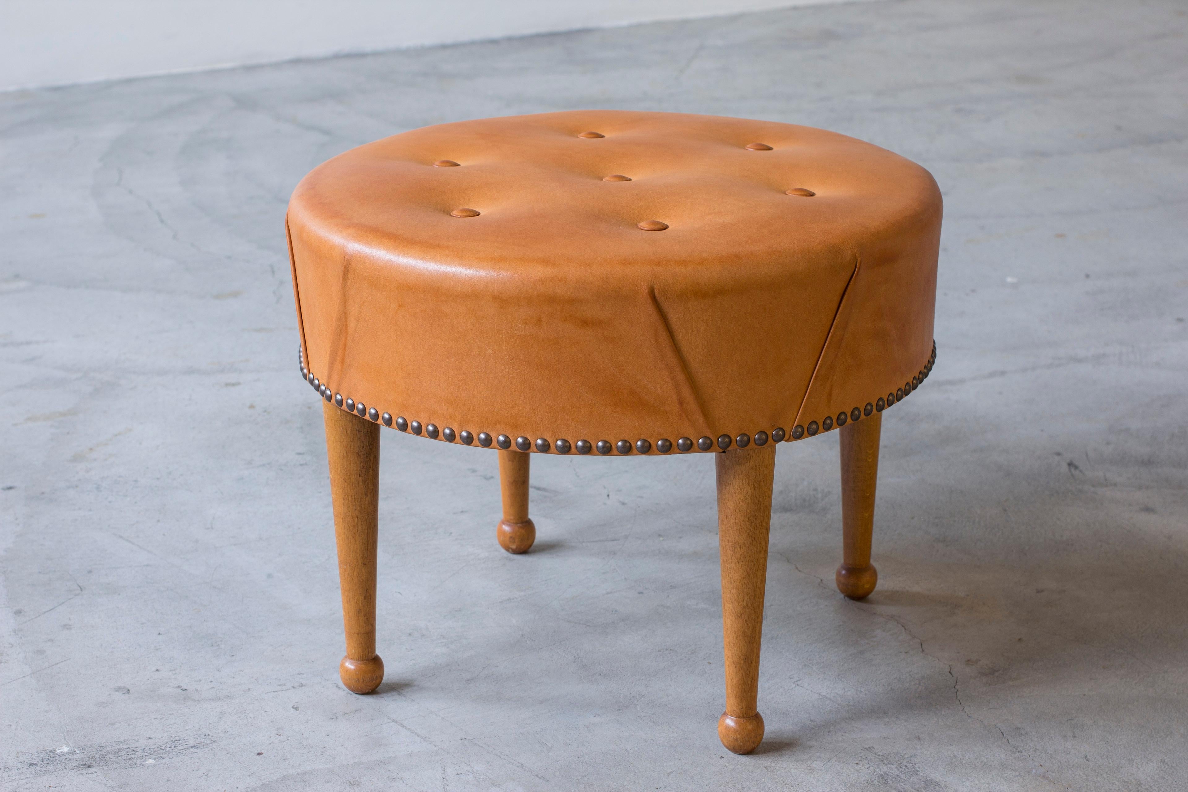 Mid-20th Century Swedish modern round leather tabouret in the style of Josef Frank, 1940s For Sale