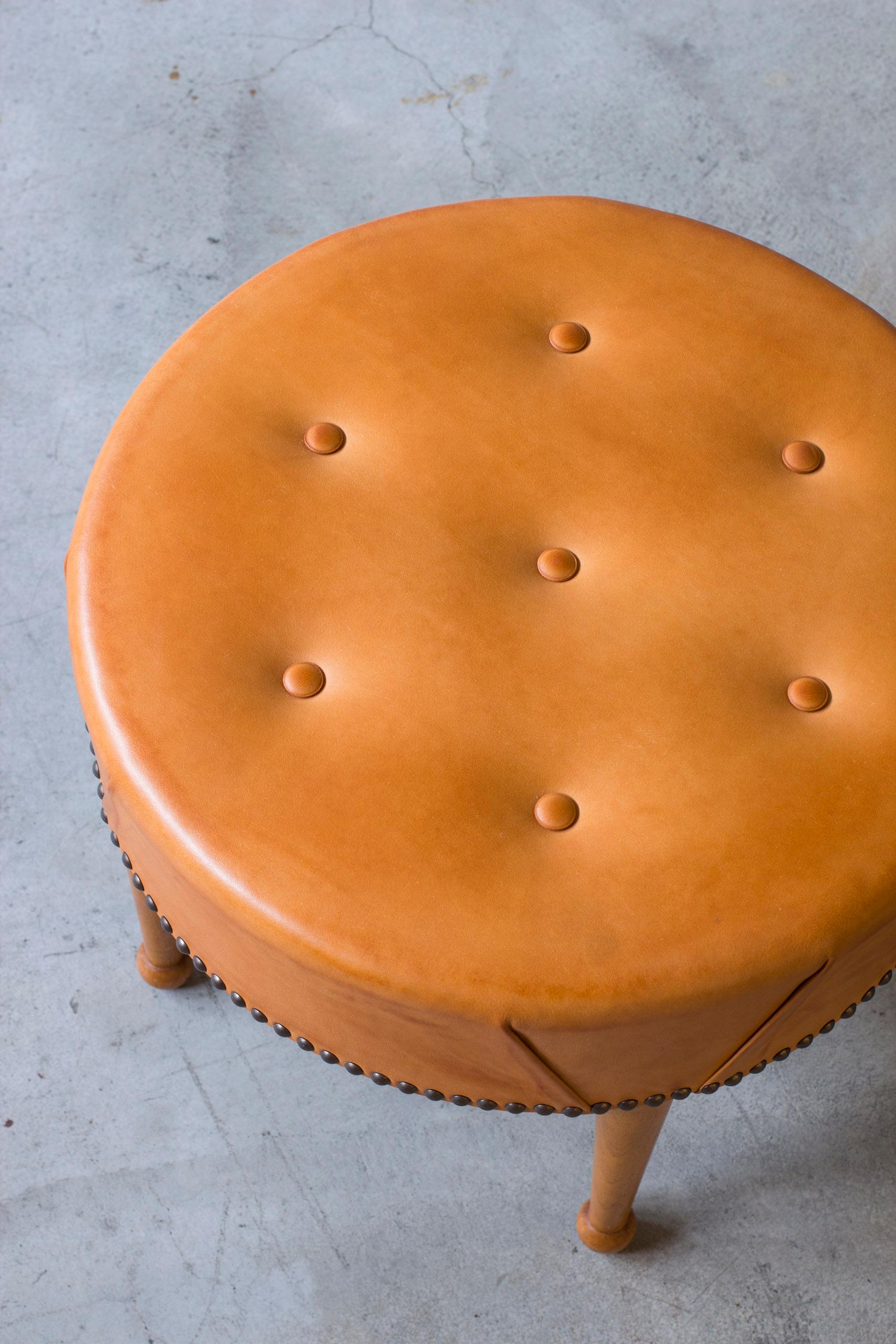 Brass Swedish modern round leather tabouret in the style of Josef Frank, 1940s For Sale