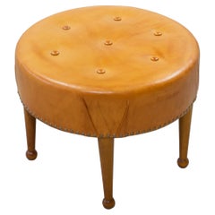 Swedish modern round leather tabouret in the style of Josef Frank, 1940s