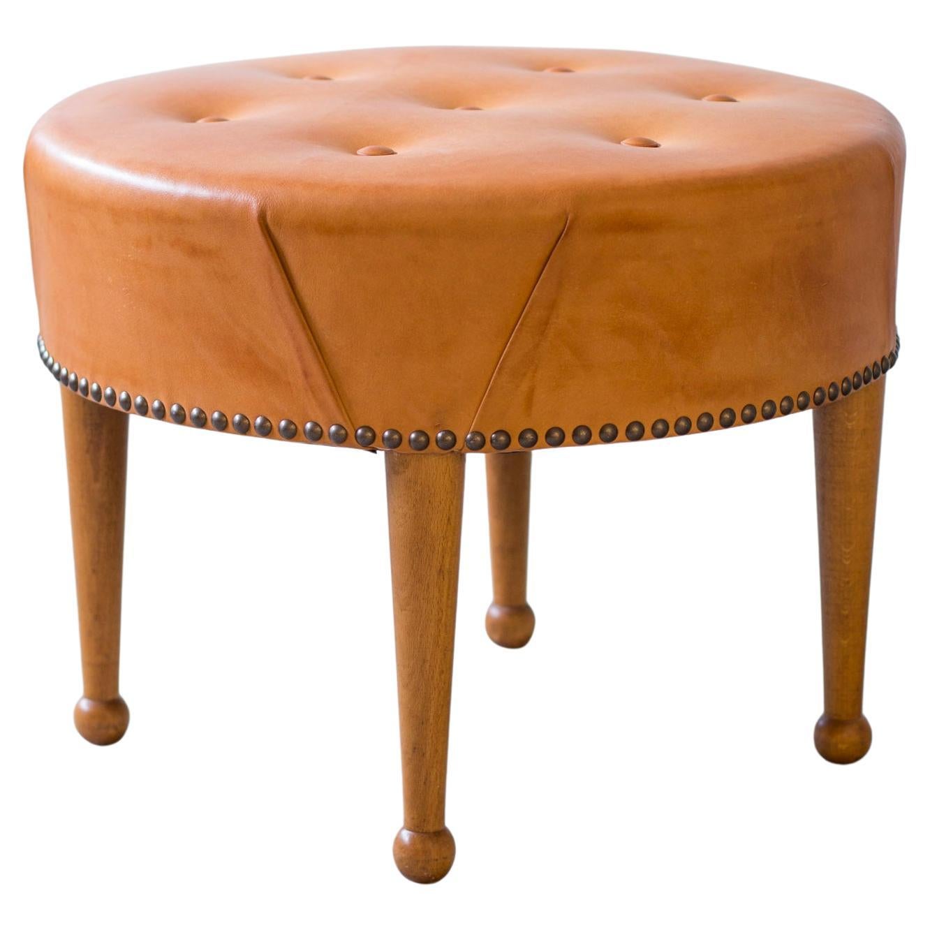 Swedish modern round leather tabouret in the style of Josef Frank, 1940s For Sale