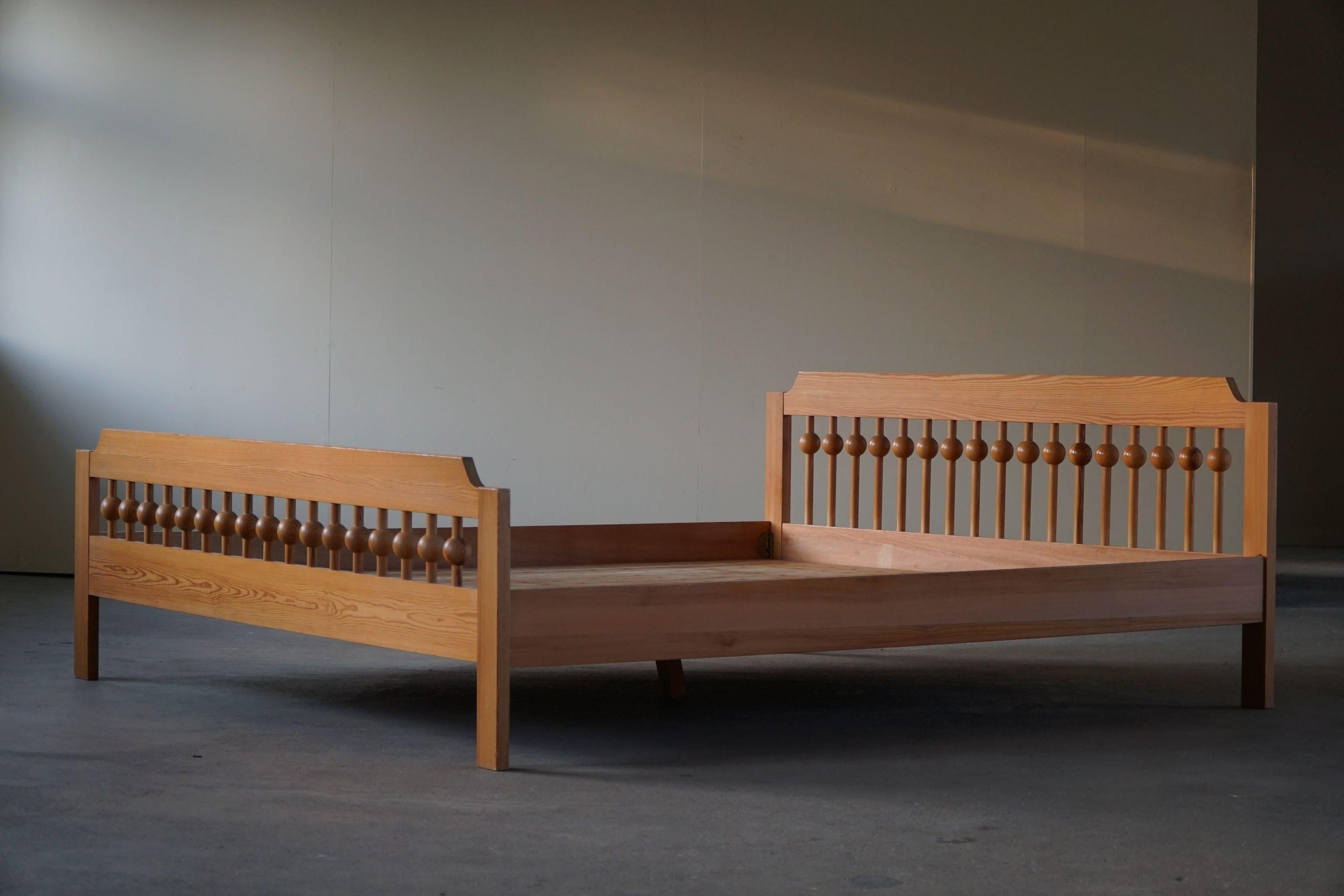 Large freestanding bed in solid pine, crafted by Swedish designer Sven Larsson in 1960s. Such a sculptural figure for the modern interior with plenty of details.

Height is measured from the top of the back rail. It measures 36 cm to the top of