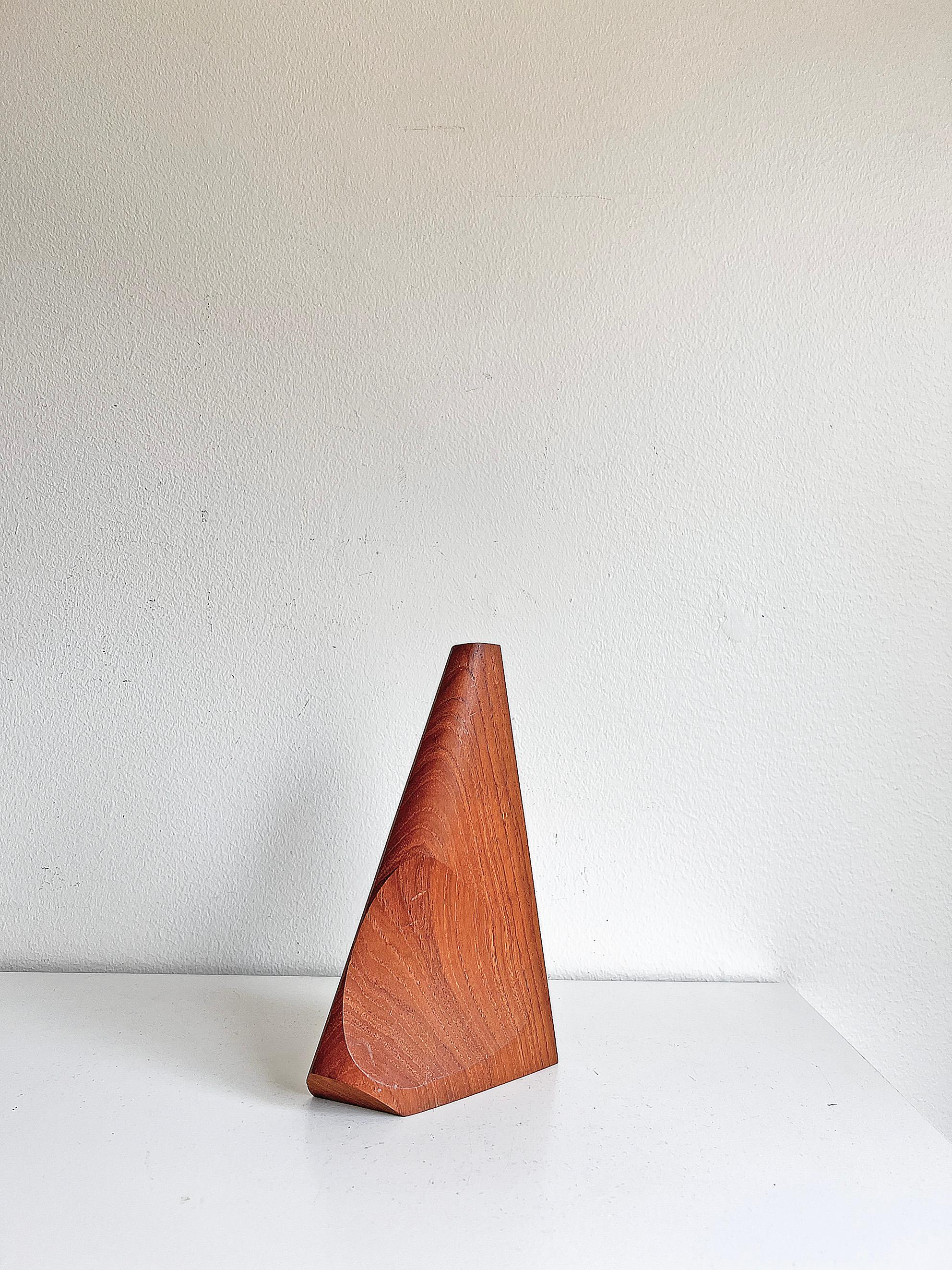 Swedish modern sculptural vase in teak with glas tube inside. Most probably produces in Sweden during 1950 - 1960s. Unknown maker and designer. 
Good vintage condition, wear consistent with age and use.