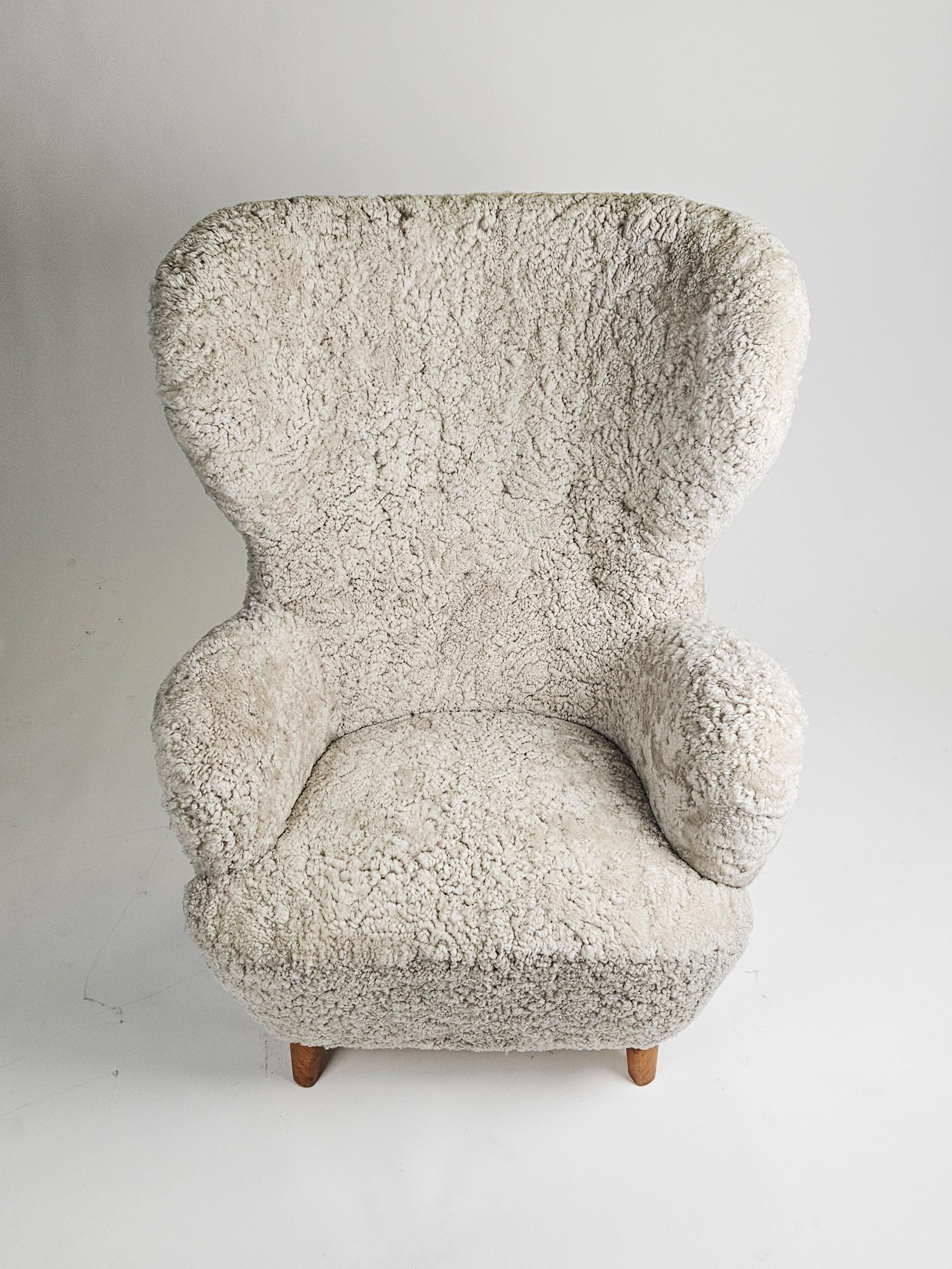 20th Century Swedish modern sheepskin easy chair in the style of Otto Schulz, 1950s For Sale