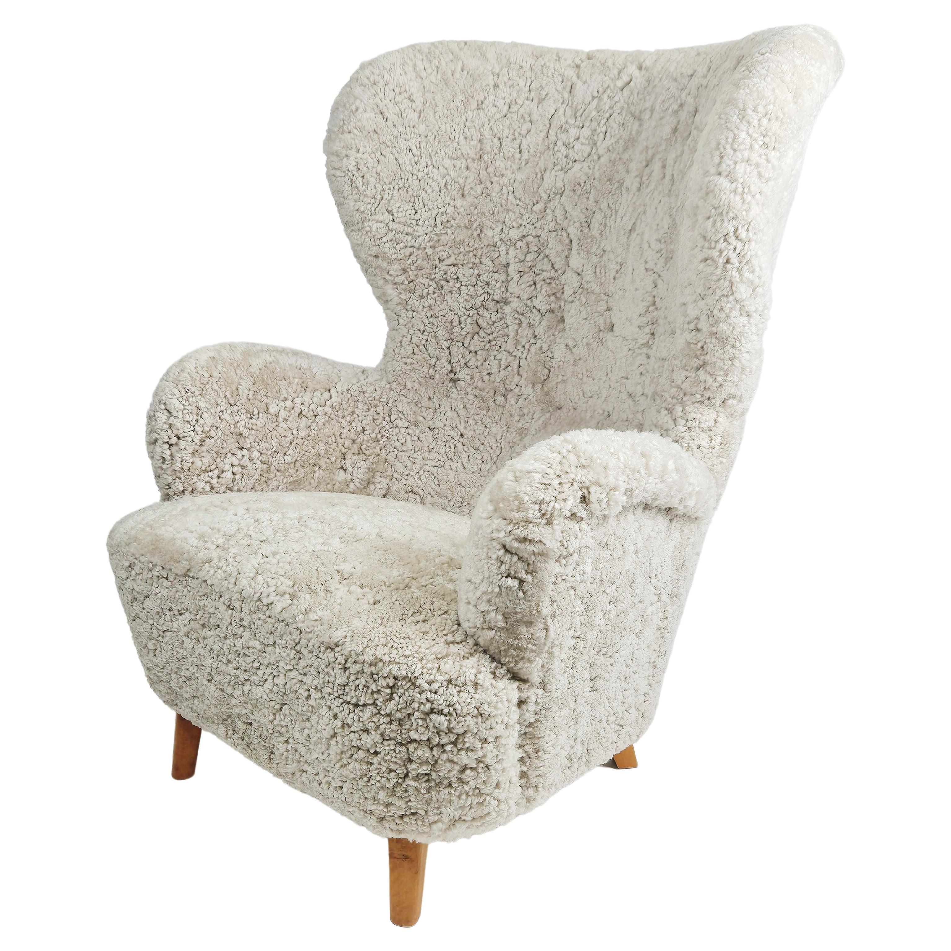 Swedish modern sheepskin easy chair in the style of Otto Schulz, 1950s For Sale