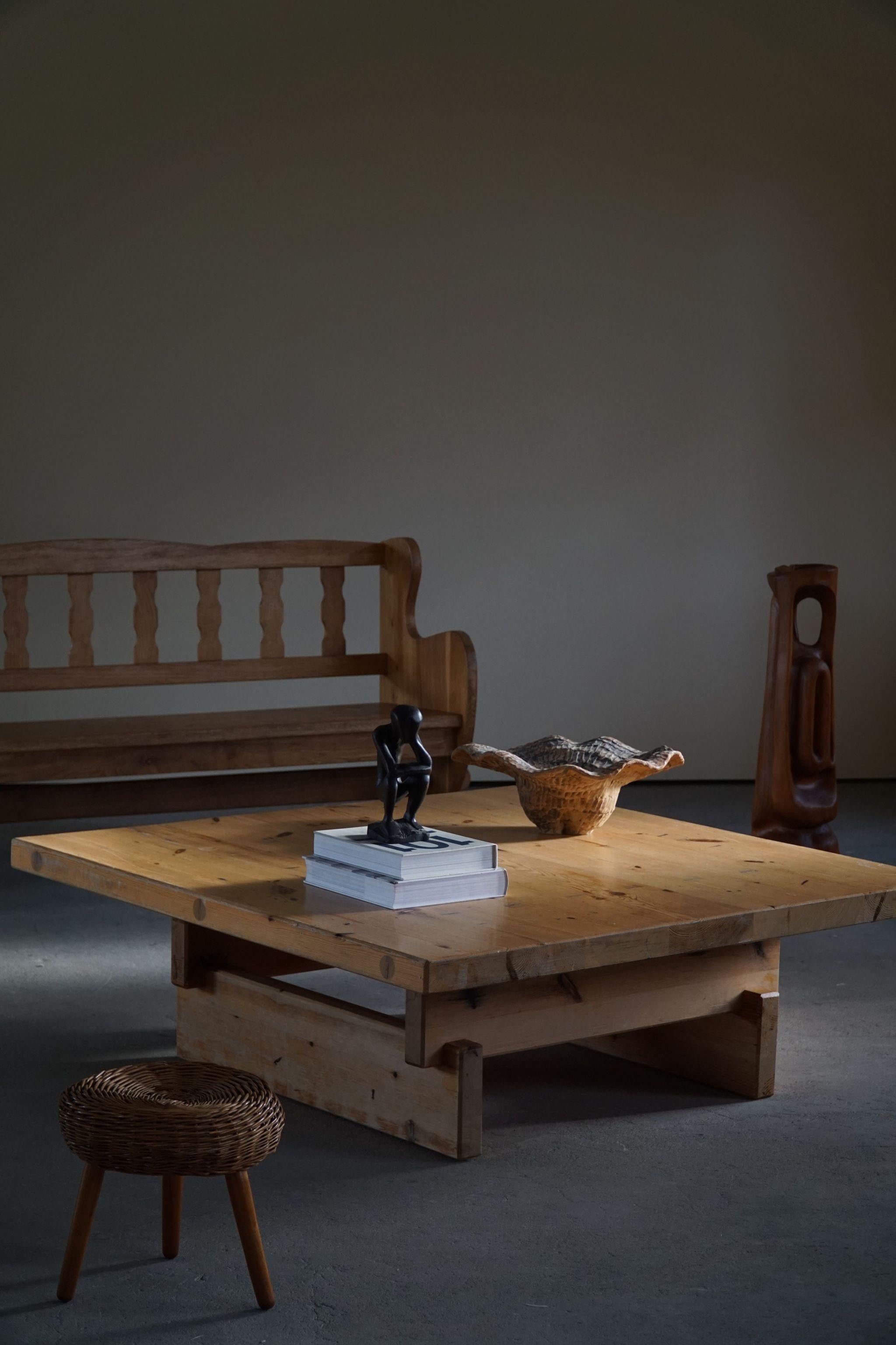 Large square Swedish modern coffee table in solid pine, made by Roland Wilhelmsson, dated 1972. Model 