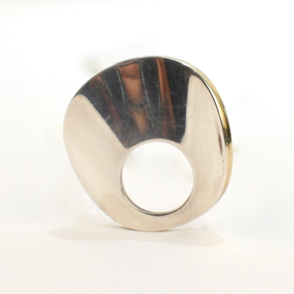 A very fine modern Swedish sterling silver convertible ring or pendant.  

The modernist simplicity of the piece is brought to life by the wavy shape of the circle.

Date:
2003

Overall Condition:
It is in overall good, used estate condition with
