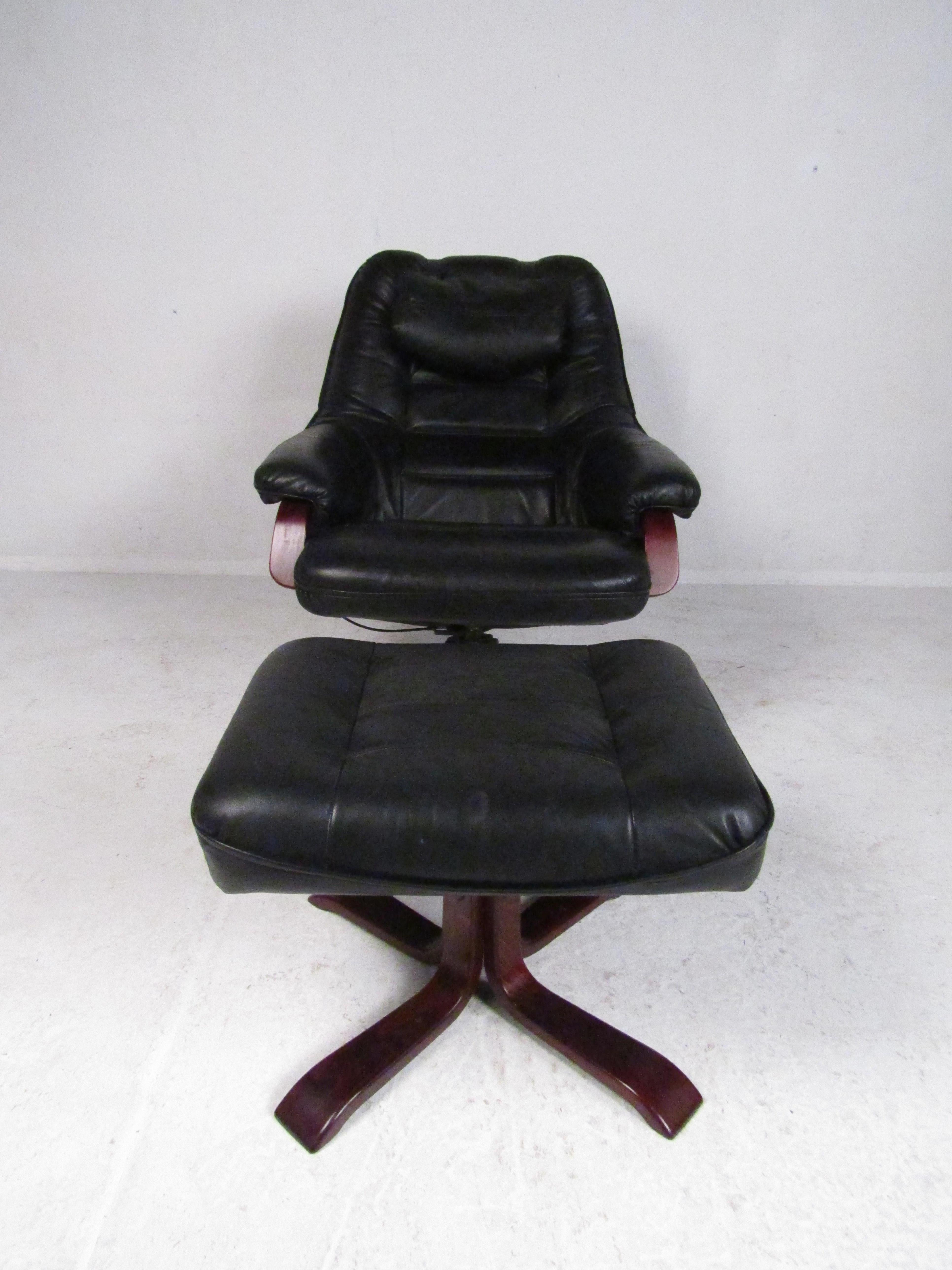 Stylish Swedish modern swiveling lounge chair and ottoman. Sleek design with leather upholstery and rosewood frames and bases. A quality piece that is sure to please in any modern interior. Please confirm item location with dealer (NJ or NY).