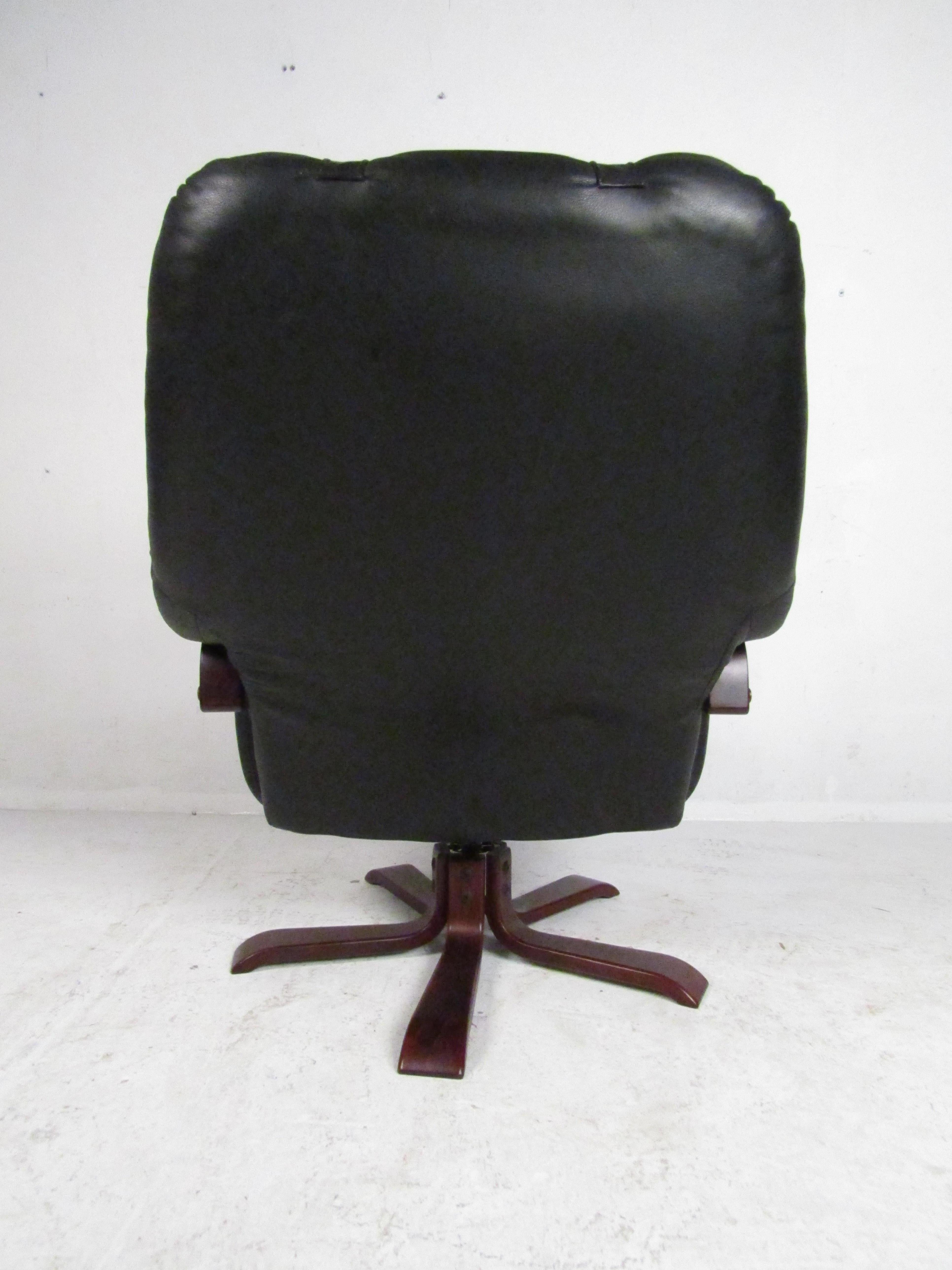 Leather Swedish Modern Swiveling Lounge Chair and Ottoman For Sale
