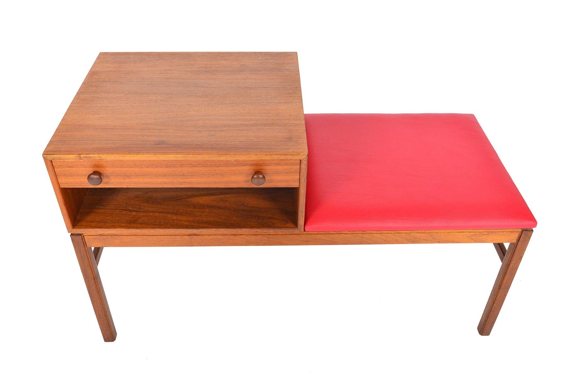 This exceptional Swedish modern “Casino” model telephone bench in teak was designed by Sven Engström & Gunnar Myrstrand for Tingströms, Bra Bohag in the 1960s. This large bench offers a removable case with a single drawer and is nestled next to the