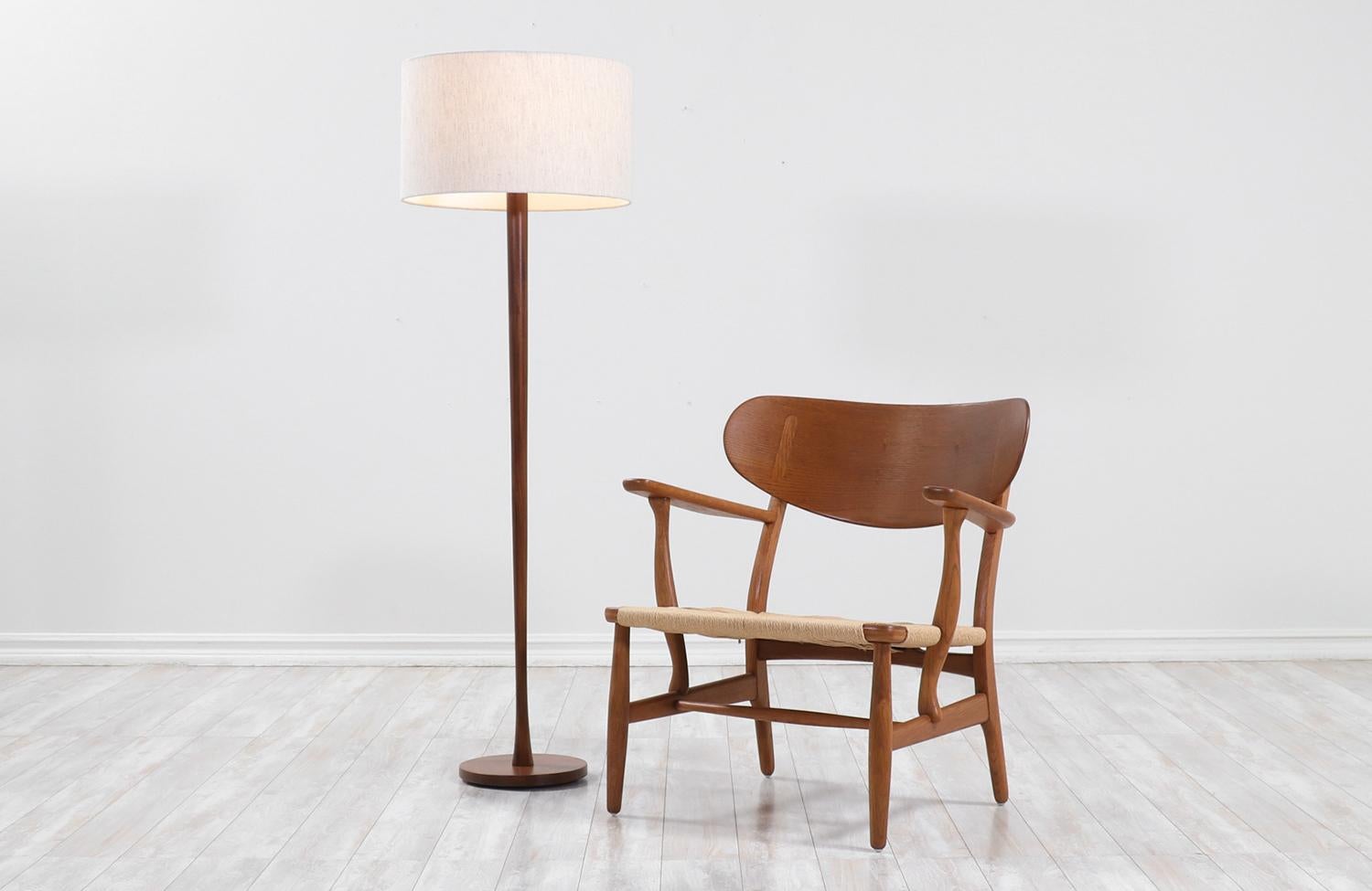 Swedish modern teak Tulip style floor lamp.