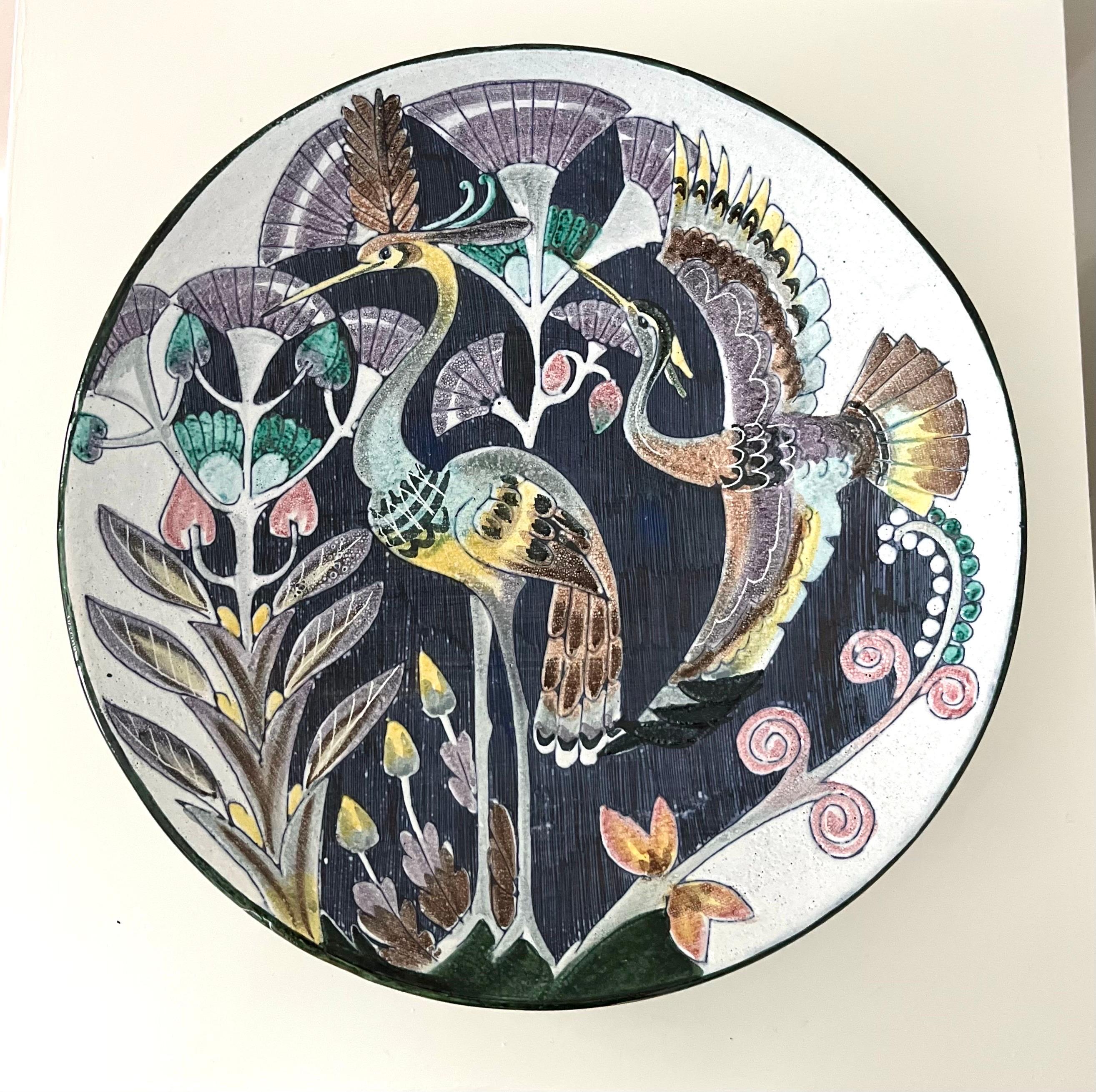 Swedish Modern Tilgmans Ceramic Wall Platter with Swans, 1958

Stunning handmade ceramic piece by Swedish Tilgmans Keramik. Fully glazed hanging wall decoration depicting two elegant birds and long stemmed plants on a cream colored background