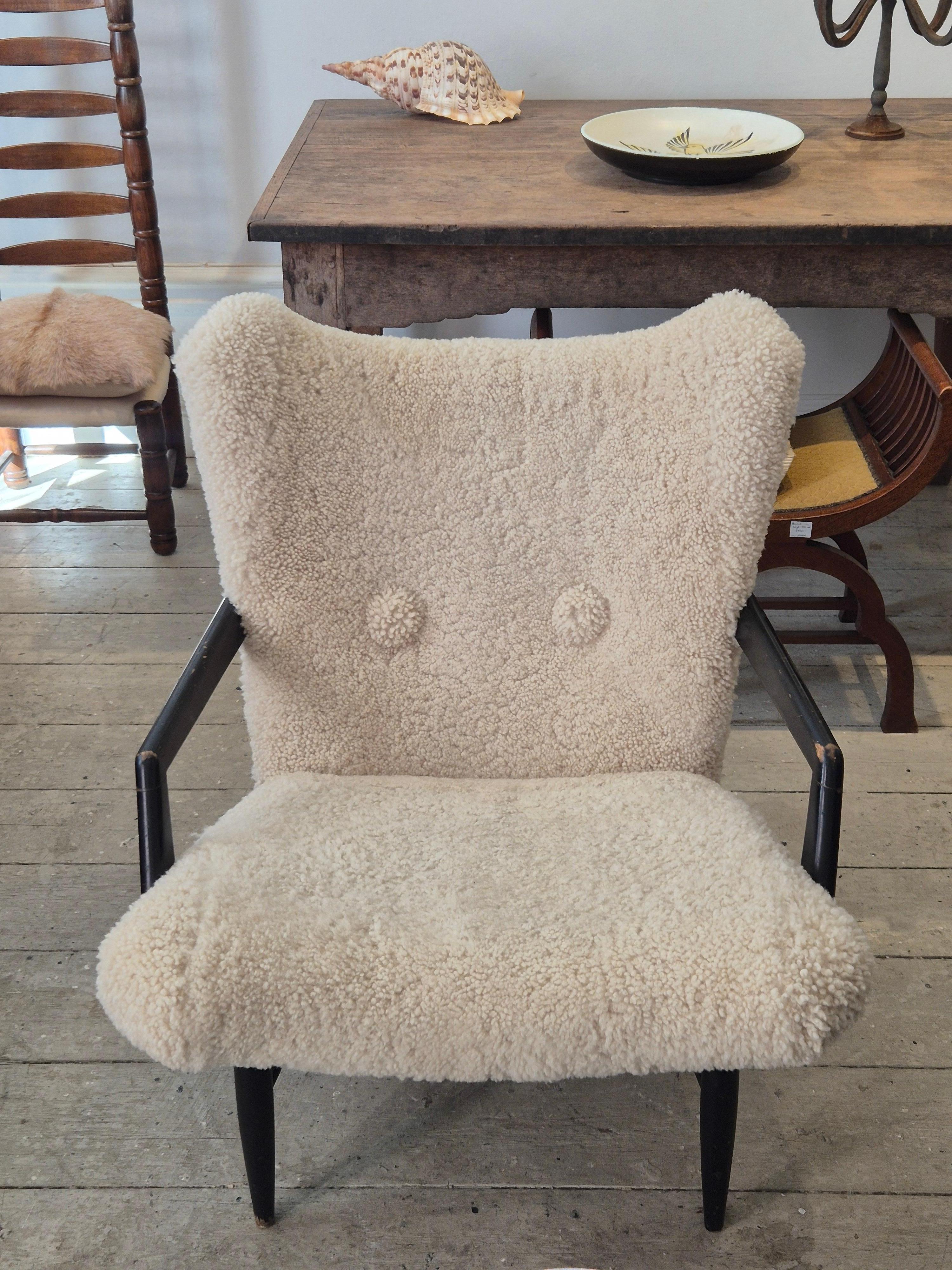 20th Century Swedish Modern, timeless easy chair in sheepskin, by Svante Skogh. Nice patina. For Sale