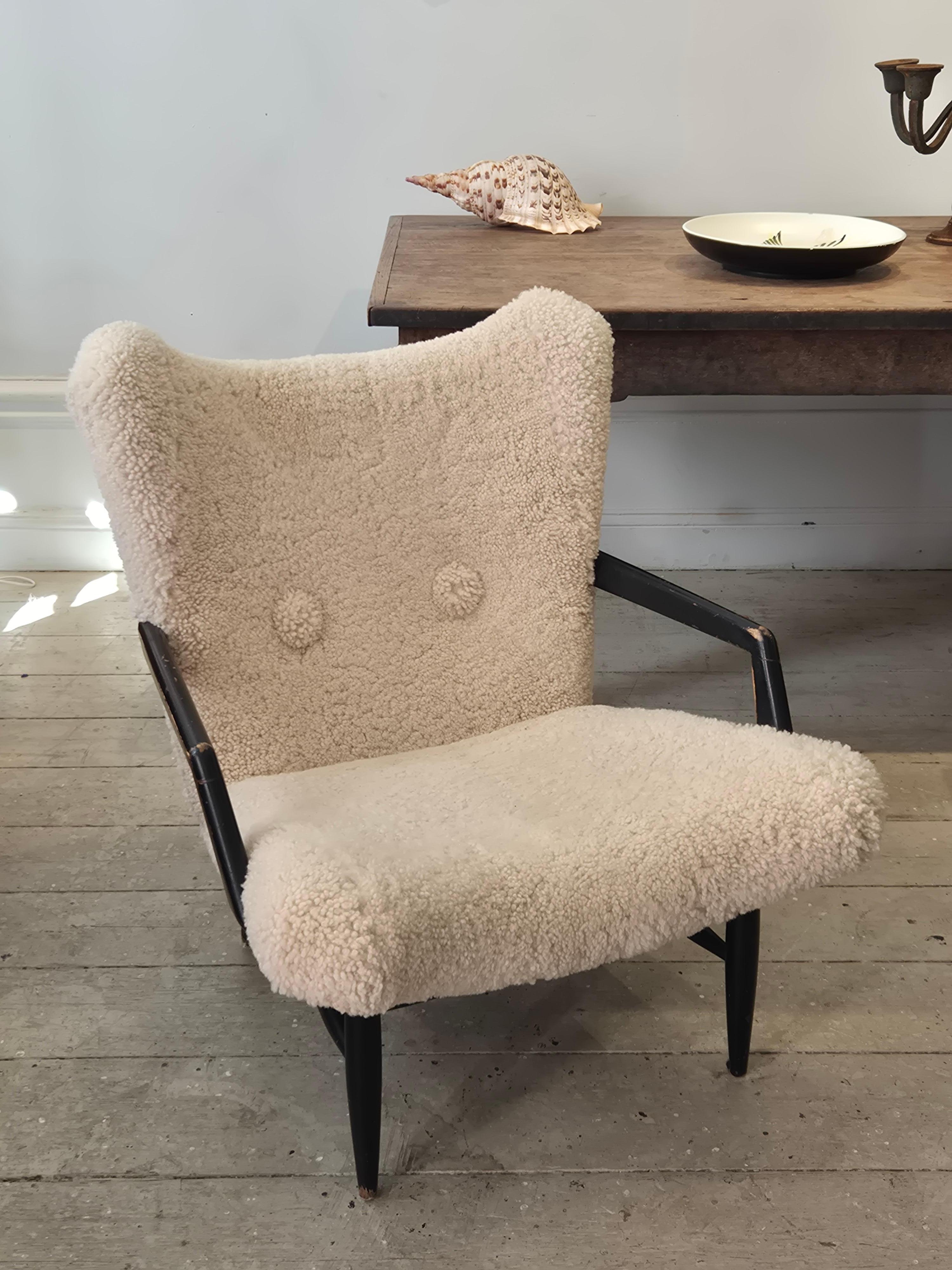 Sheepskin Swedish Modern, timeless easy chair in sheepskin, by Svante Skogh. Nice patina. For Sale