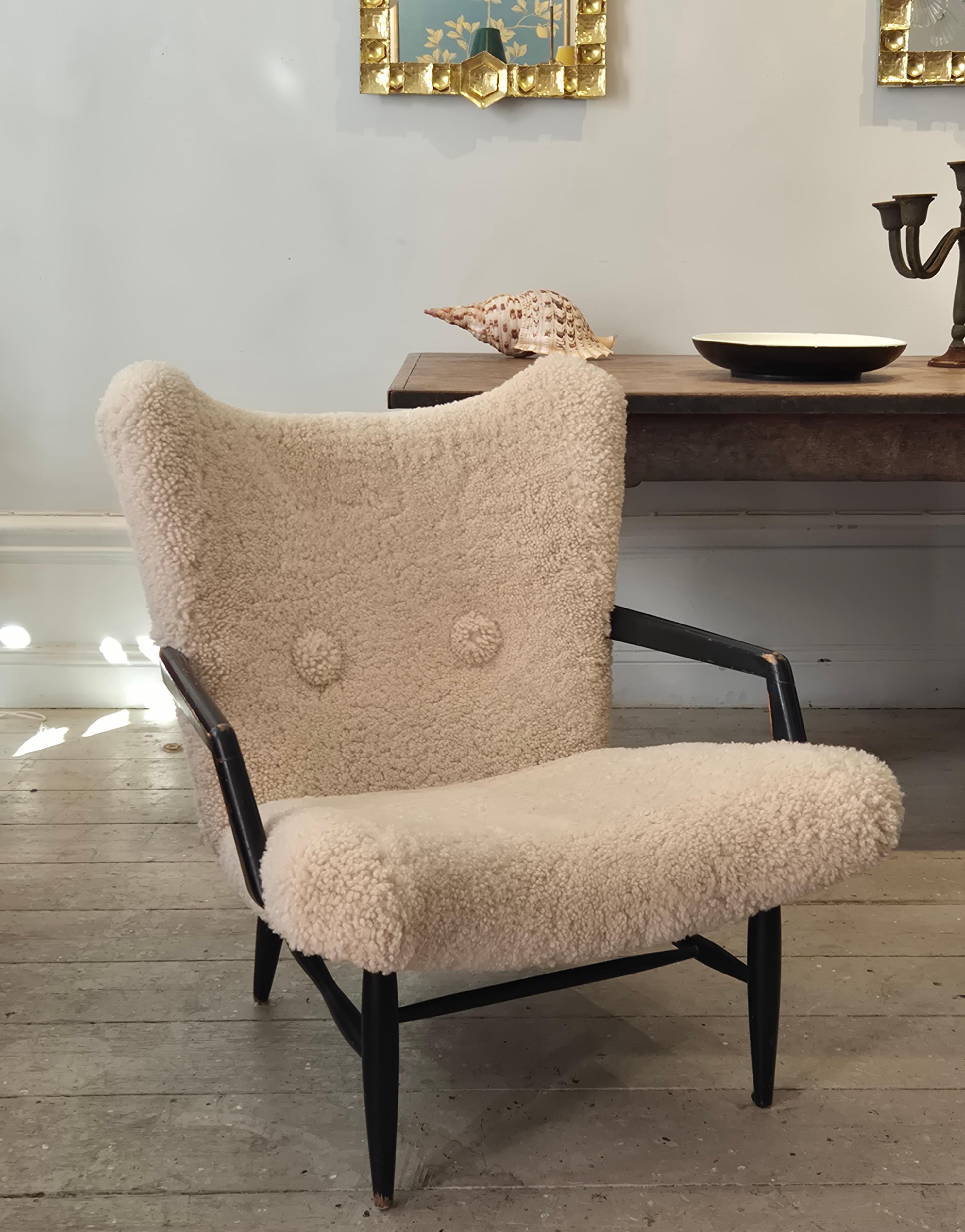 Swedish Modern, timeless easy chair in sheepskin, by Svante Skogh. Nice patina. For Sale 1