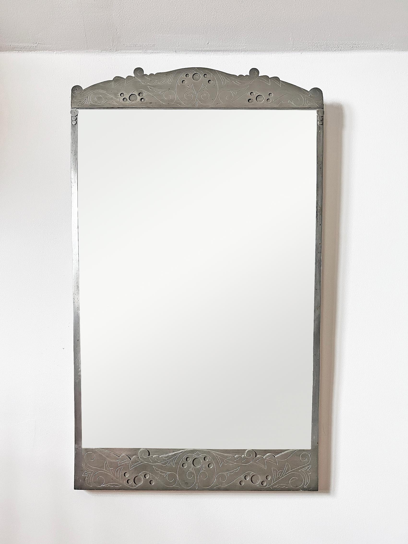 Amazing and very rare wall mirror in pewter from Swedish CAM - 1929.
Very decorative piece. 
Signed with makers mark on the back. 
Please notice a discreet inscription on the back. 
Good vintage condition.
Mirror glass: wear and patina