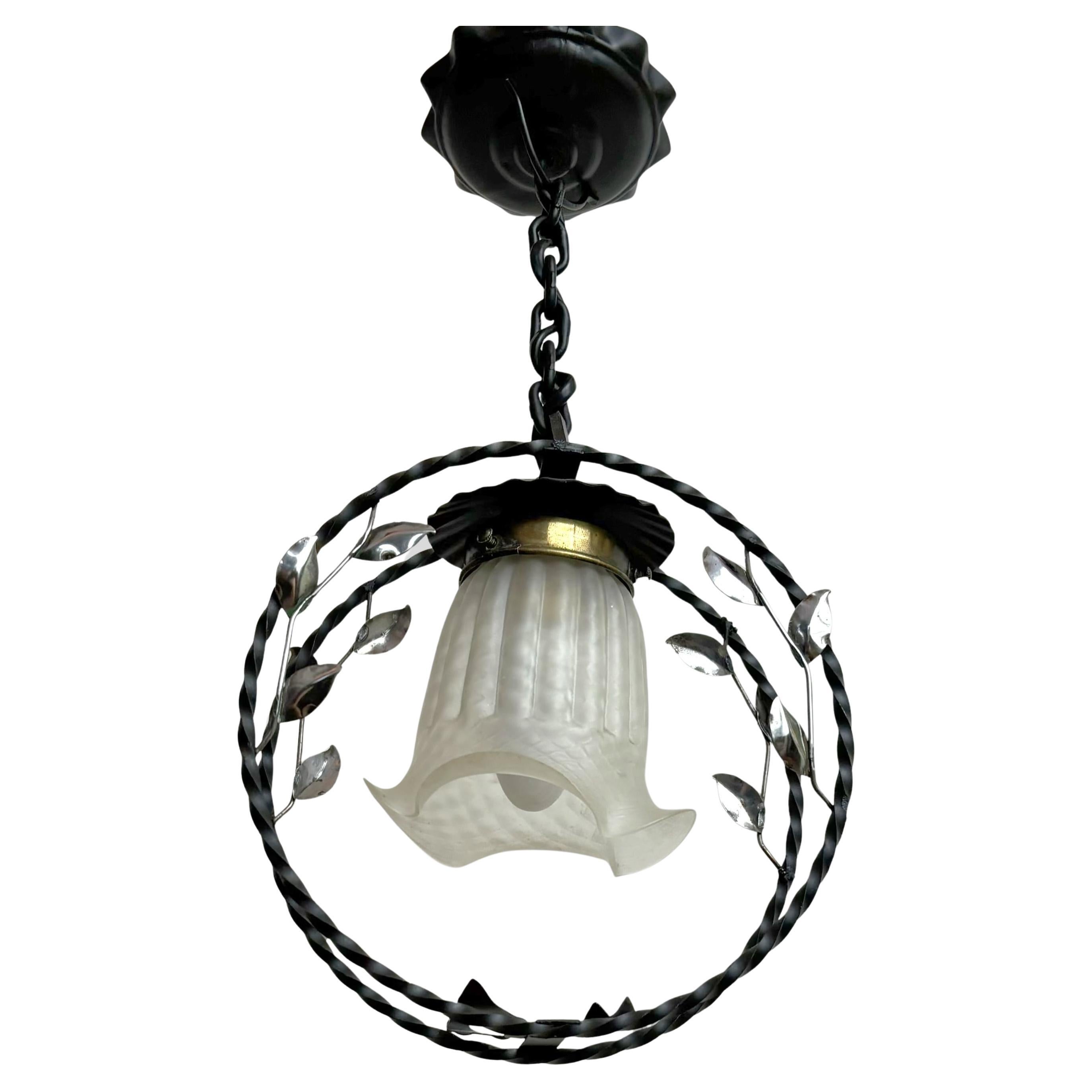 Swedish modern wrought iron pendant lamp with organic leaf decor, 1940s