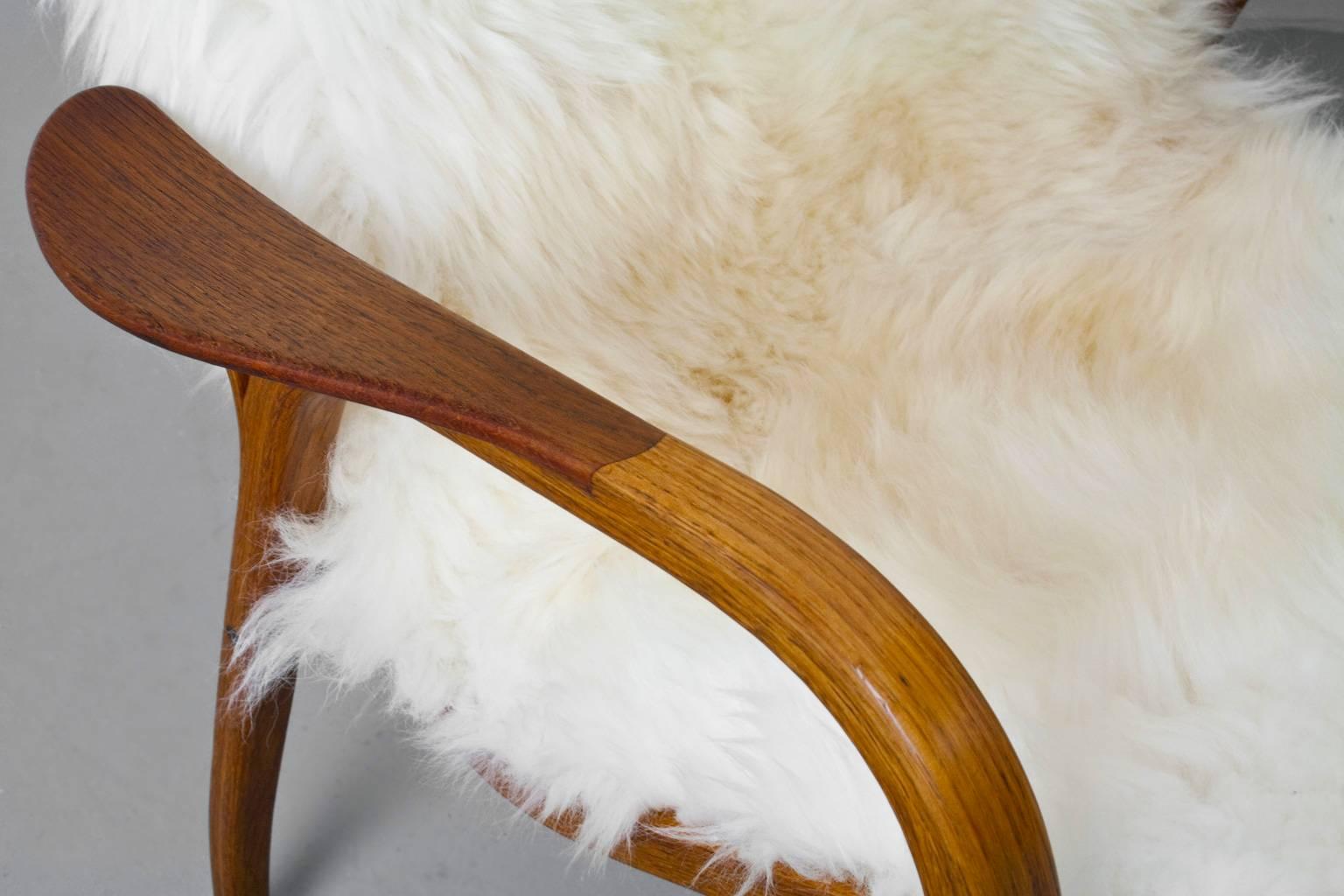Oiled Swedish Modern Yngve Ekström Lamino Chair with New Sheepskin Upholstery