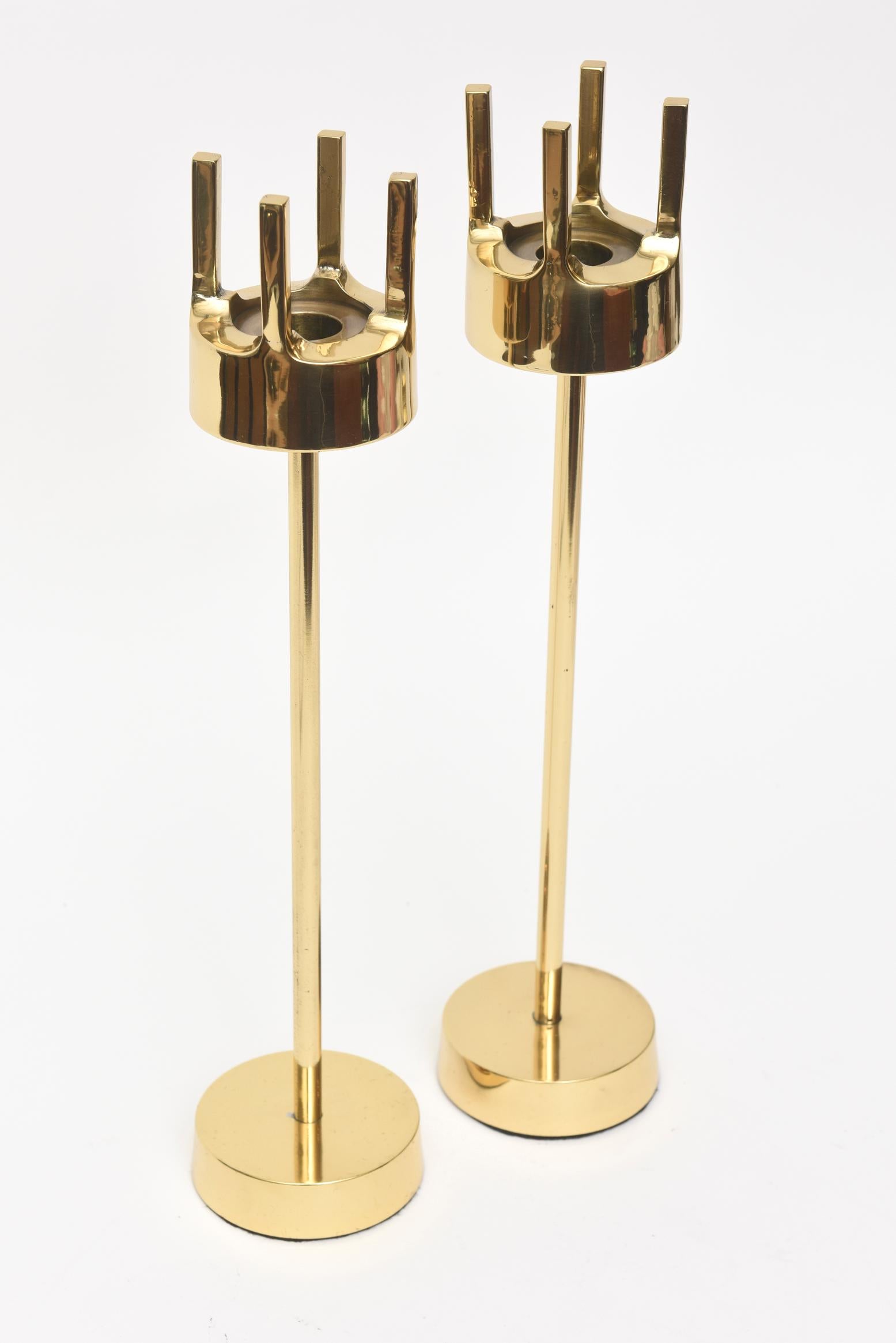 This great pair of vintage Swedish polished brass modernist midcentury brass candlesticks are in the style and attribution of Pierre Forsell for Skultana. Their period is late 1950s-early 1960s. They are not signed. They are sculptural, artful and