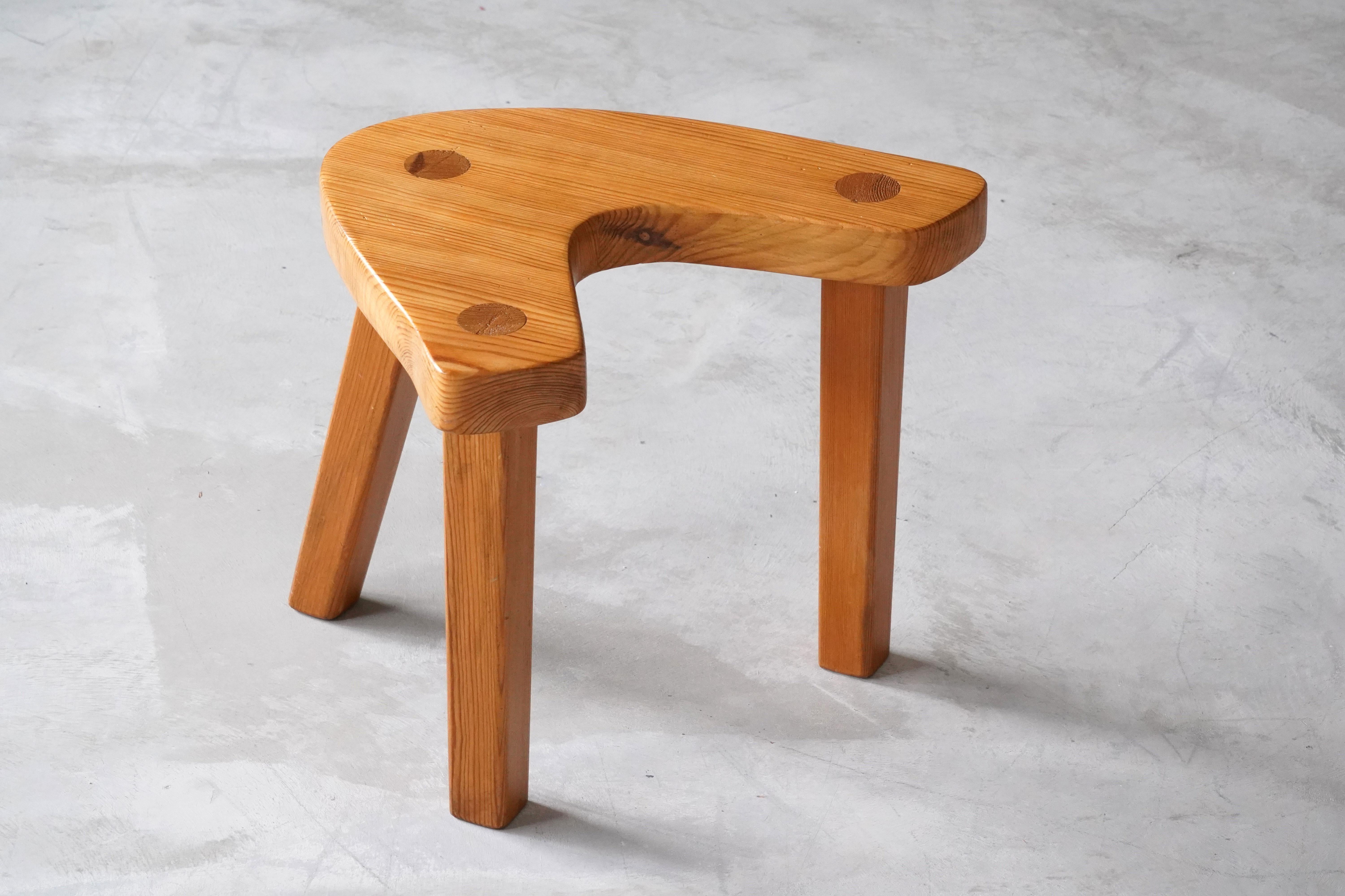A handcrafted modernist stool or side table. Executed by an unknown designer, 1960s, Sweden. The organically shaped seat is mounted on 3 legs with revealed joinery. 

Other designers of the period include Roland Wilhelmsson, Axel Einar Hjorth,