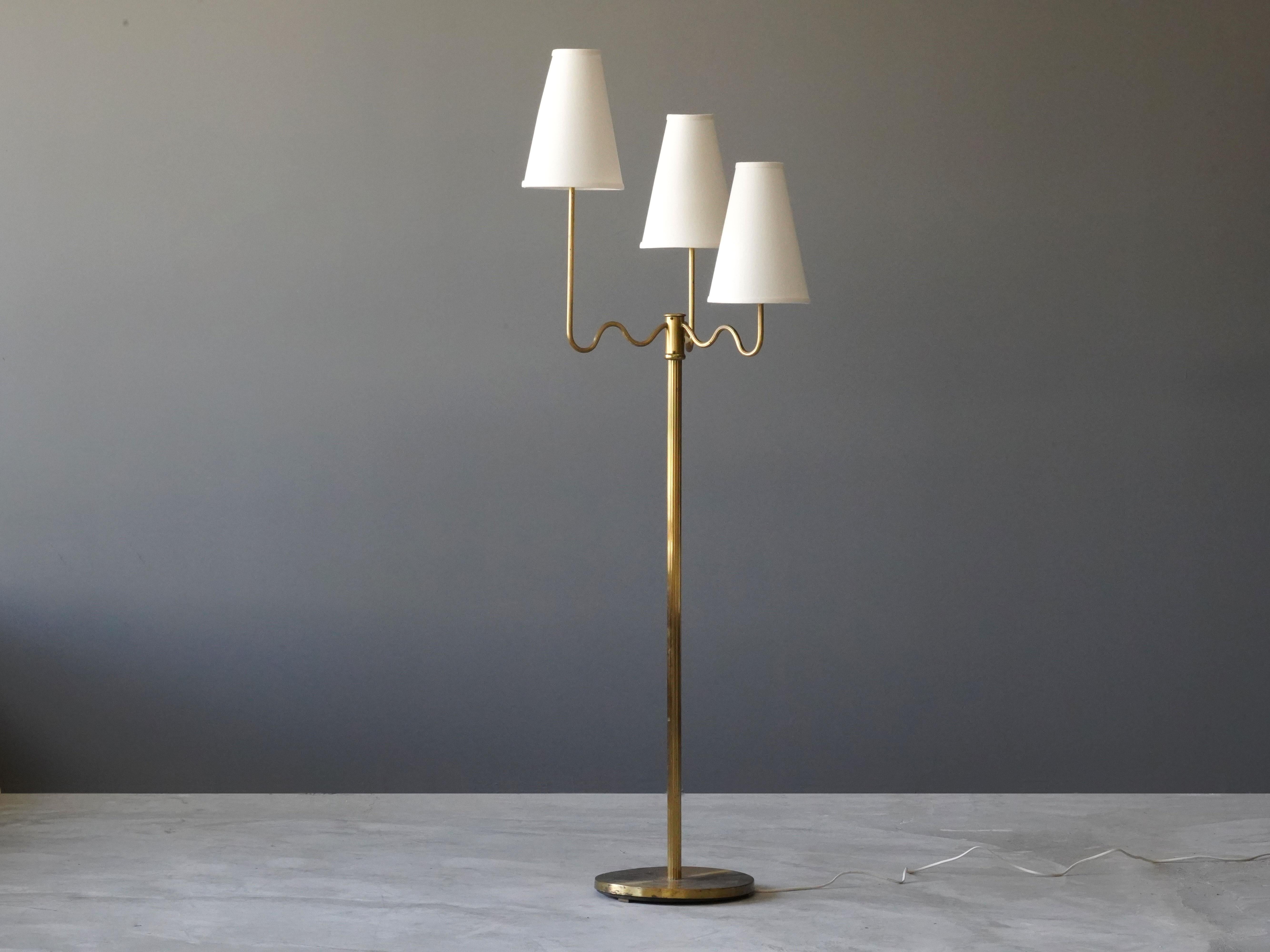 An organic three-armed floor lamp. Designed by an unknown Swedish modernist designer, circa 1930s. 

Other designers working in the organic style include Jean Royere, Gio Ponti, Vladimir Kagan, Ico Parisi, and George Nakashima.