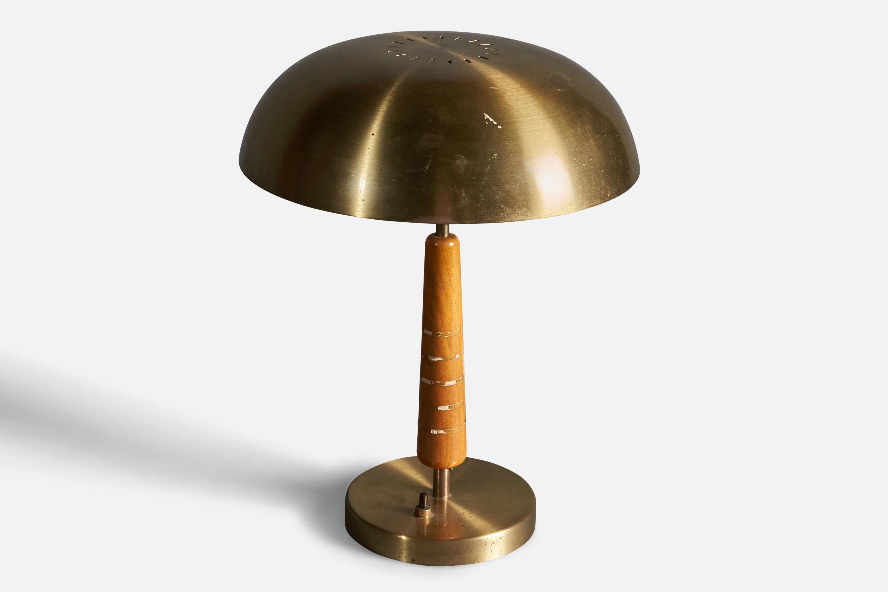 An early modernist table lamp. In brass and stained oak with inlays. Produced in Sweden, 1940s.

Other designers of the period include Paavo Tynell, Lisa Johansson-Pape, Carl-Axel Acking, and Gunnar Asplund.