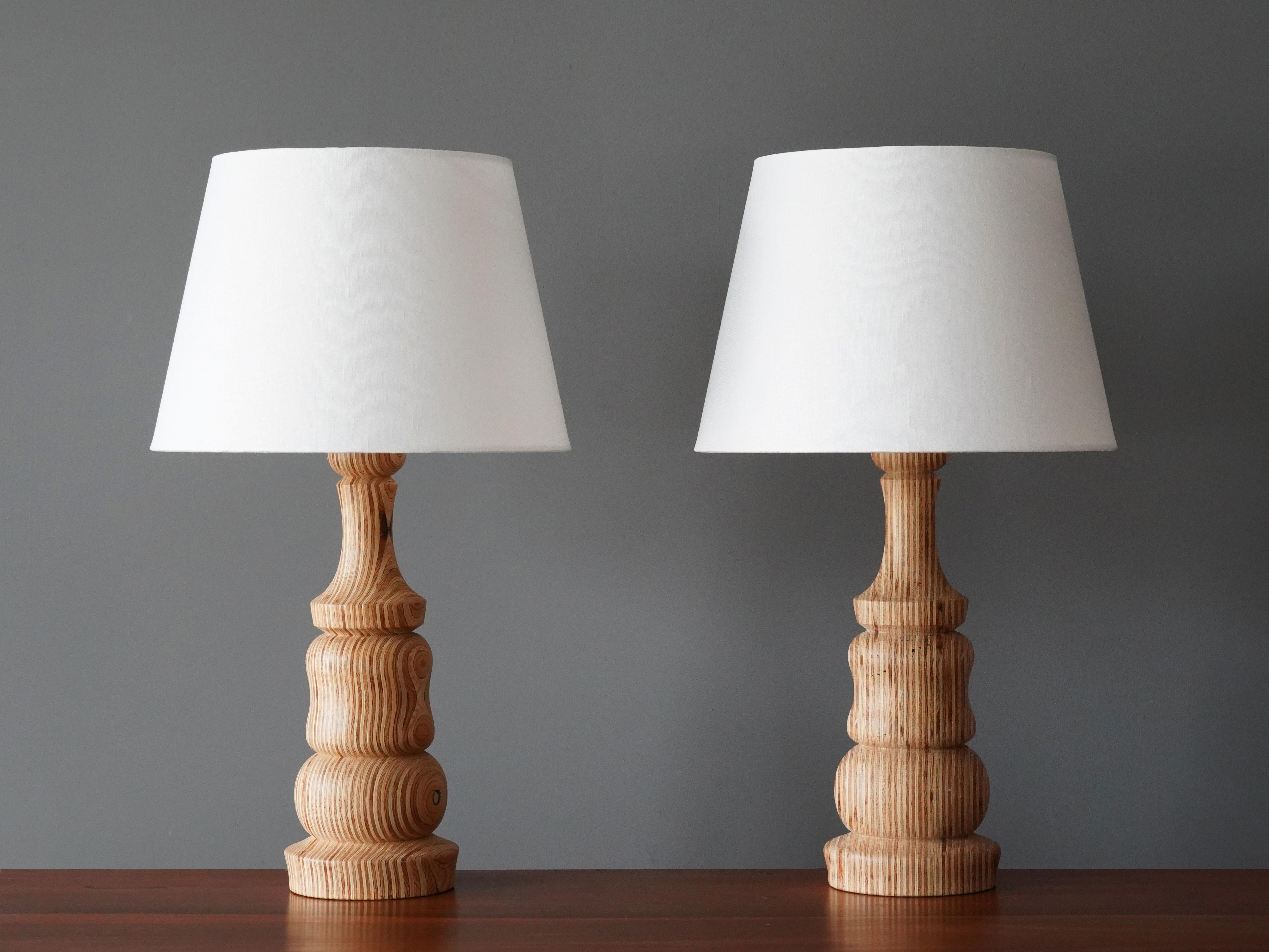 A pair of modernist table lamps. In stack-laminated turned wood with a highly sculptural appeal and beautiful texture. Produced in Sweden by an anonymous creator, 1960s.

Other designers of the period include Paavo Tynell, Josef Frank, Alvar Aalto.