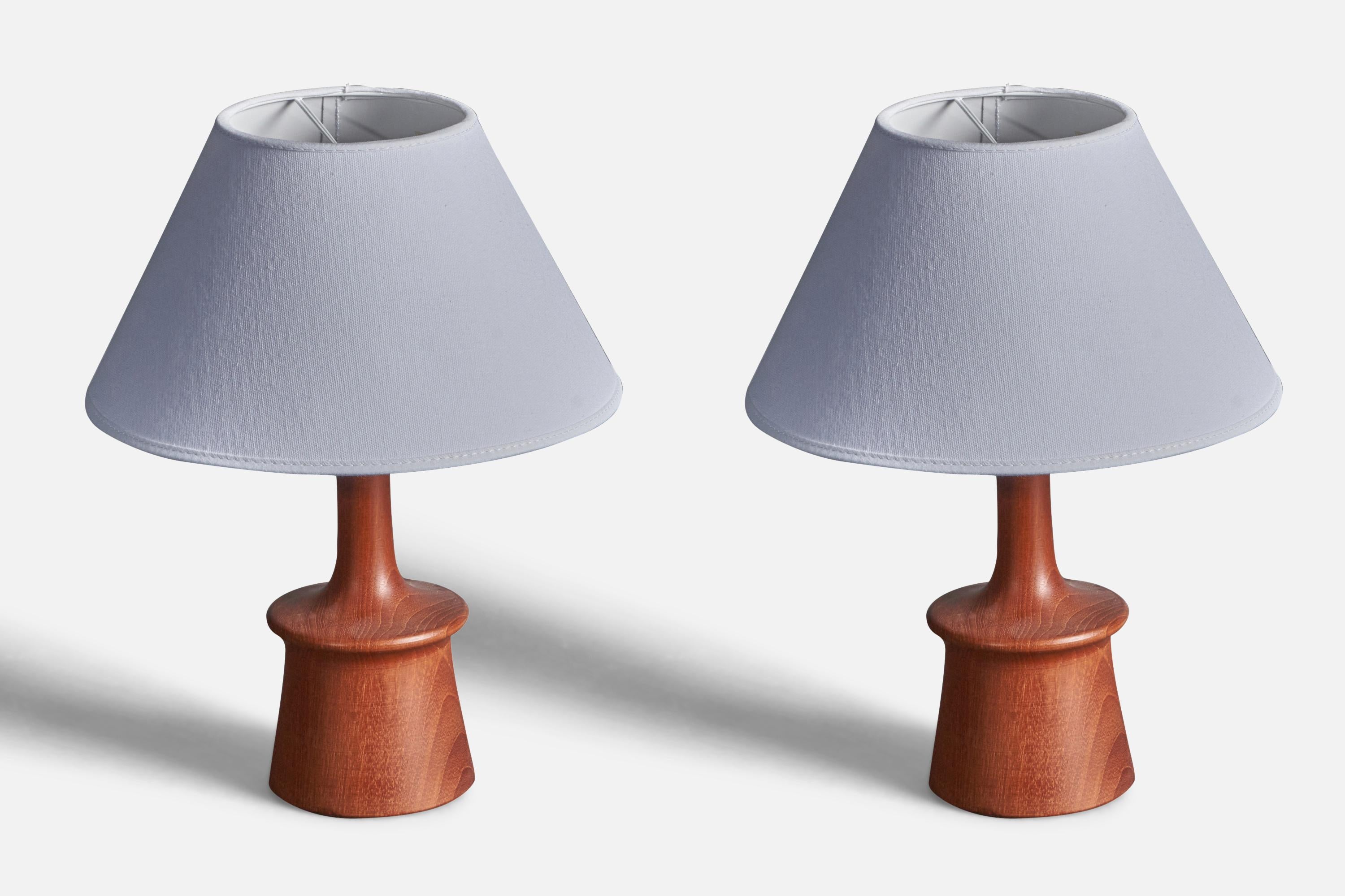 A paur finely sculpted teak table lamps. Produced in Sweden, 1960s. 

Dimensions without lampshades. Height includes socket. Sold without lampshade.

Other designers of the period include Hans Agne Jacobsen, Josef Frank, Palshus, Kaare Klint,