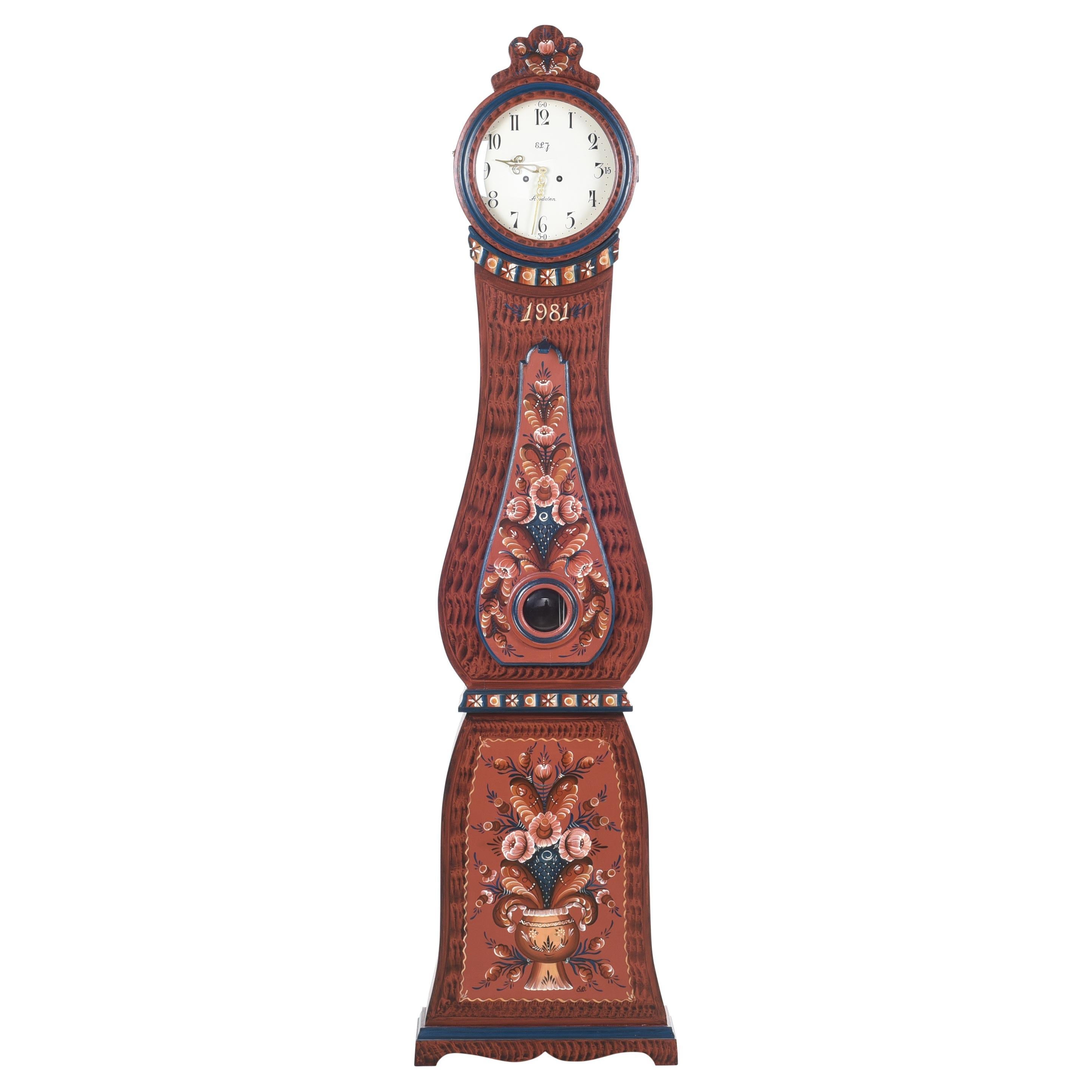 Swedish Mora clock dated 1981 in traditional Swedish folk patterns and flowers. Signed clock with makers initials 'ELJ' and village where the clock was made 'Aldden'. Working Longcase clock mechanism of pendulum and 2 weights and a bell chime on the