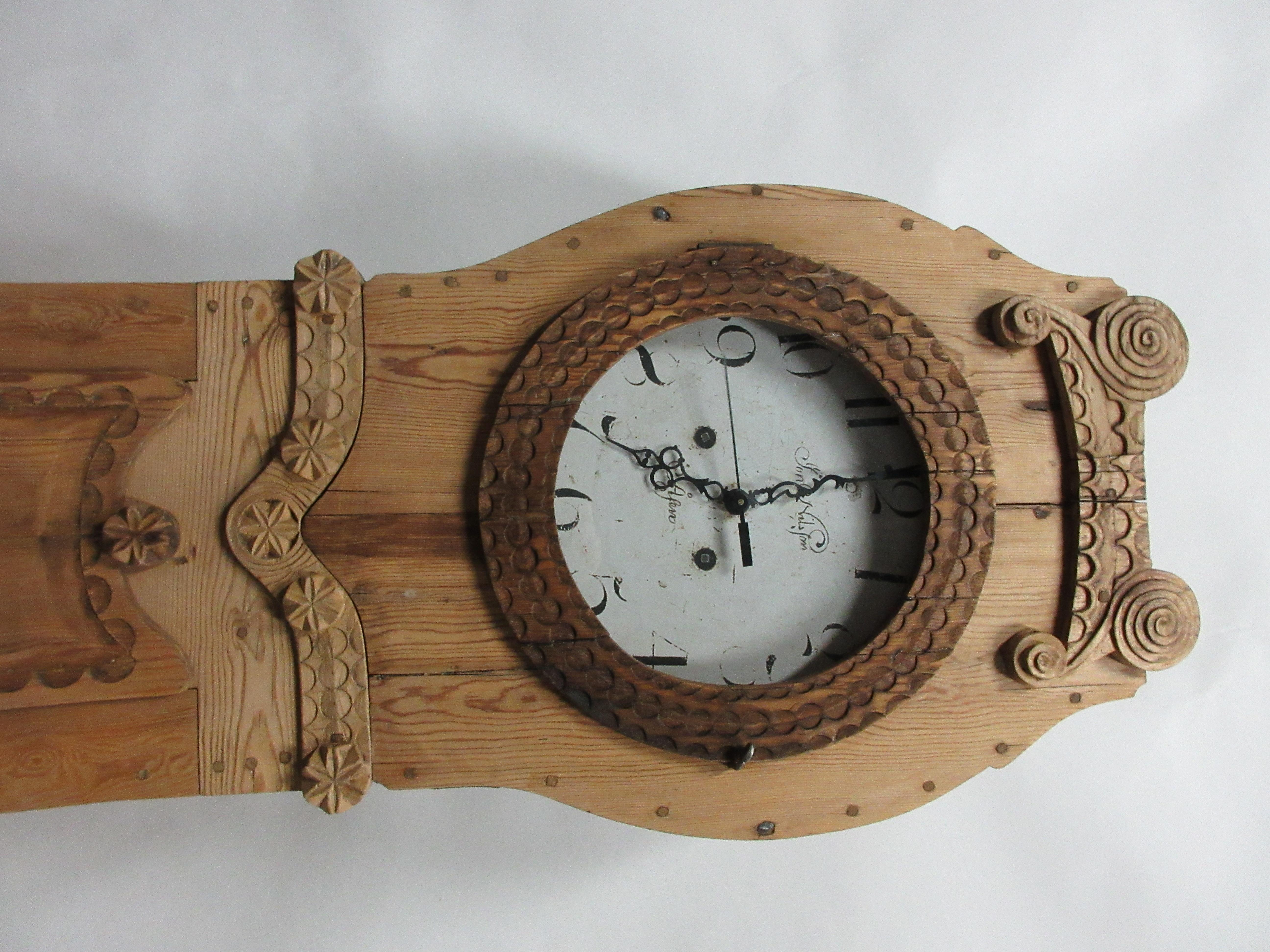 This is a natural finish Swedish Mora clock. the old works have been removed and replaced with New Battery clock works. the Original works are offered with each clock.