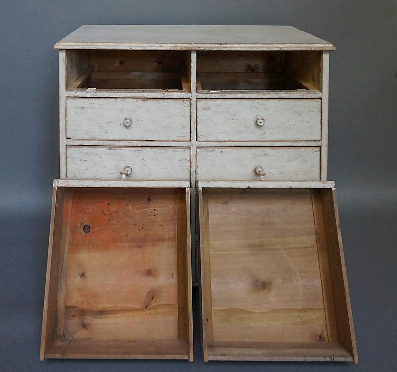 Swedish “bank of drawers,” circa 1860. Eight drawers in simple case with molded top and square bracket feet. All original with later paint.