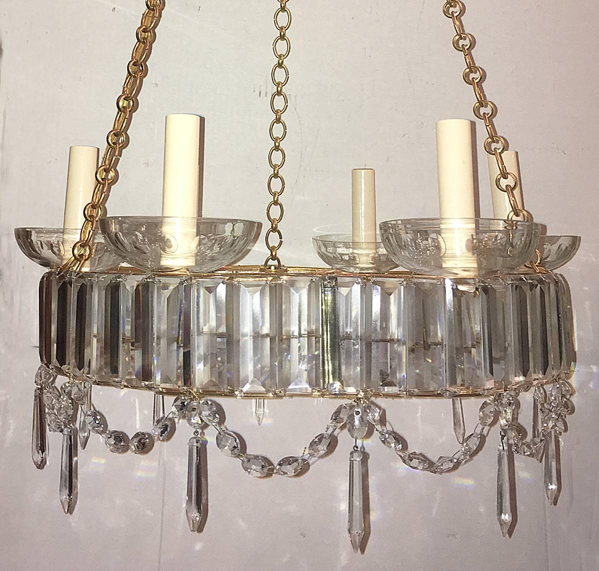 A circa 1930's Swedish six-light neoclassic chandelier with crystal insets, etched bobeches, bronze chain and canopy.

Measurements:
Height: 24
