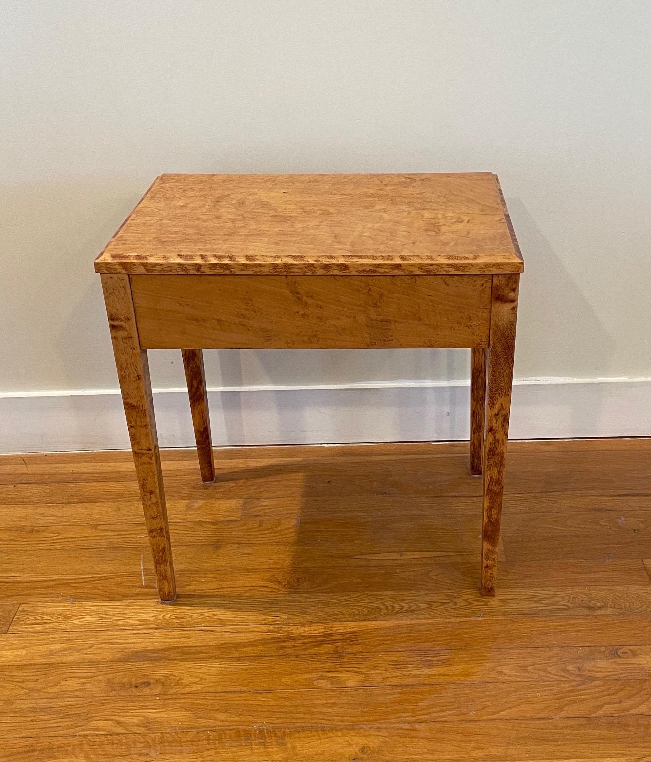 A petite table crafted of Nordic birch with an ebonized, diamond shaped inlay in the apron. Of the Svensk-Jugend Still period, the table dates to roughly 1910. The original finish has been restored to a soothing golden glow.