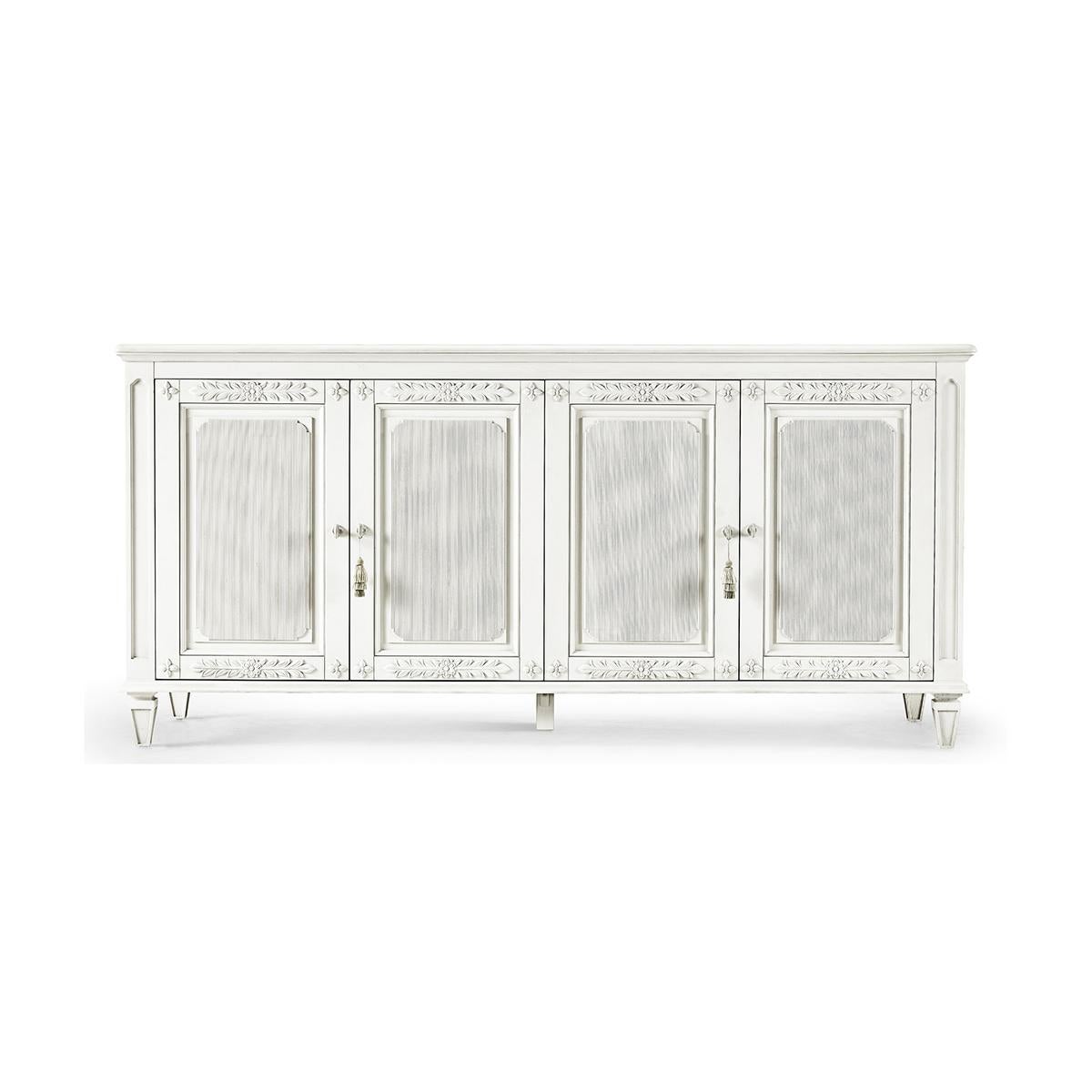 Swedish neoclassic painted buffet, elegant form and functionality. With four neoclassical-style doors with hand-carved floral trim open to a pair of drawers and adjustable shelving with removable dividers on the right for added versatility.

The