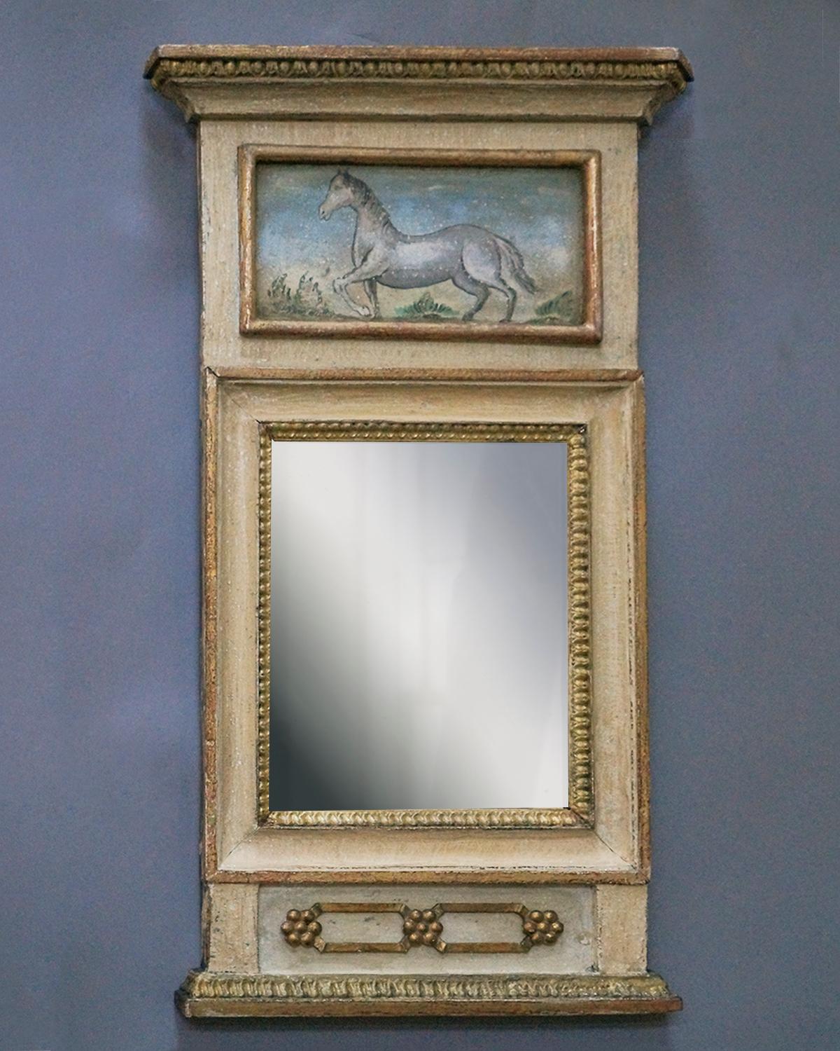 Period Swedish mirror, circa 1790, with original painted and parcel-gilt surface, mirror glass, and back. The unusual upper panel features a prancing white horse. A charming and characteristically Swedish piece.