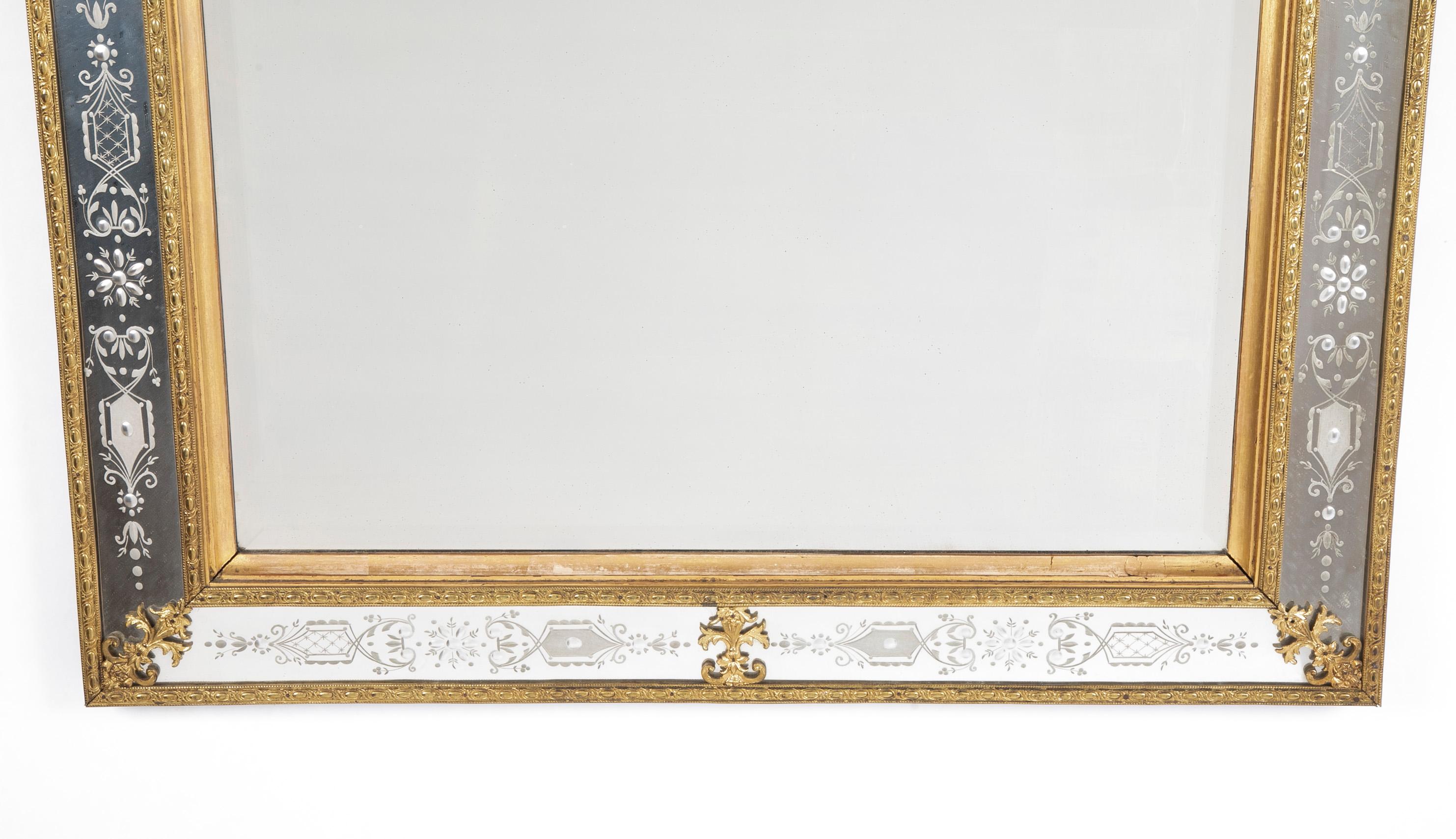 A Fine Swedish ormolu etched and engraved glass mirror after the model by Burchard Precht.The rectangular plate within a beveled foliate-decorated surround with foliate clasps, the C-scroll arched cresting centered by an oval plate flanked by