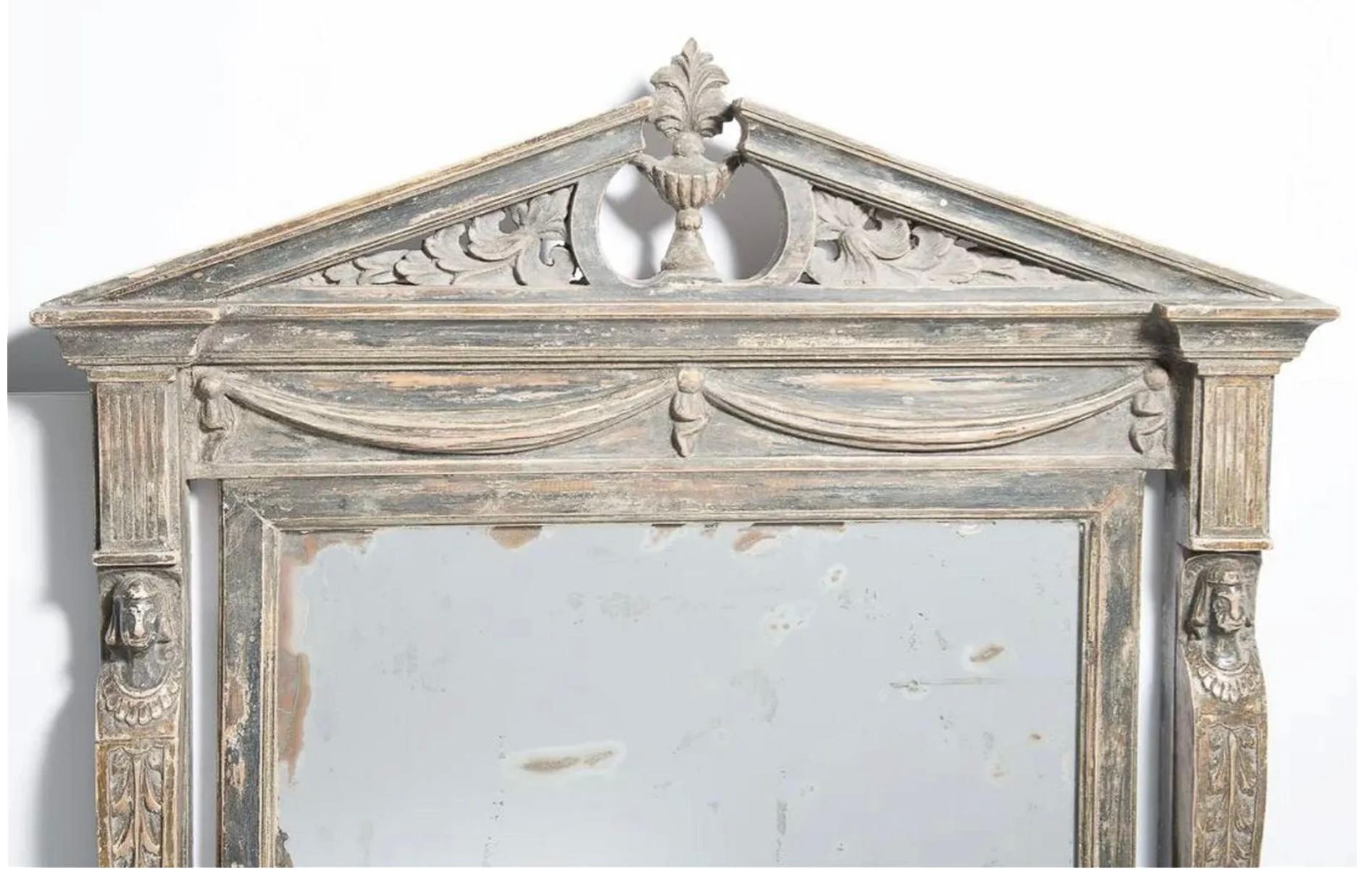 19th Century Swedish Neoclassical carved and painted Pediment Mirror.  Antique painted gray, Swedish Broken Pediment wall mirror, C.1850. Adorned with caryatides figures on each side and draped garland at the top. Original antique mirror.

