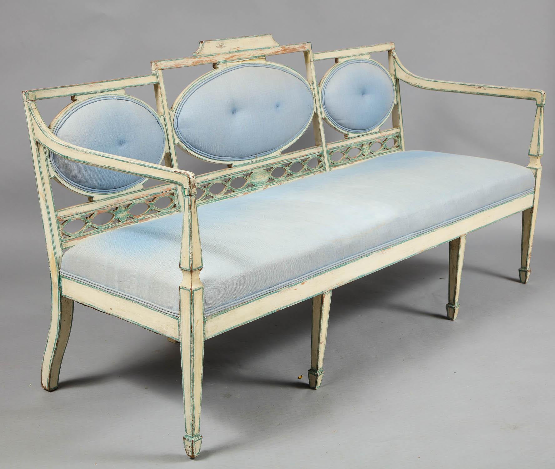 Fine early 19th century Swedish Gustavian painted neoclassical settee with oval padded back rests over lattice work lower back, the square tapered legs ending in spade feet, the whole in lovely worn old paint. Now upholstered, originally with cane