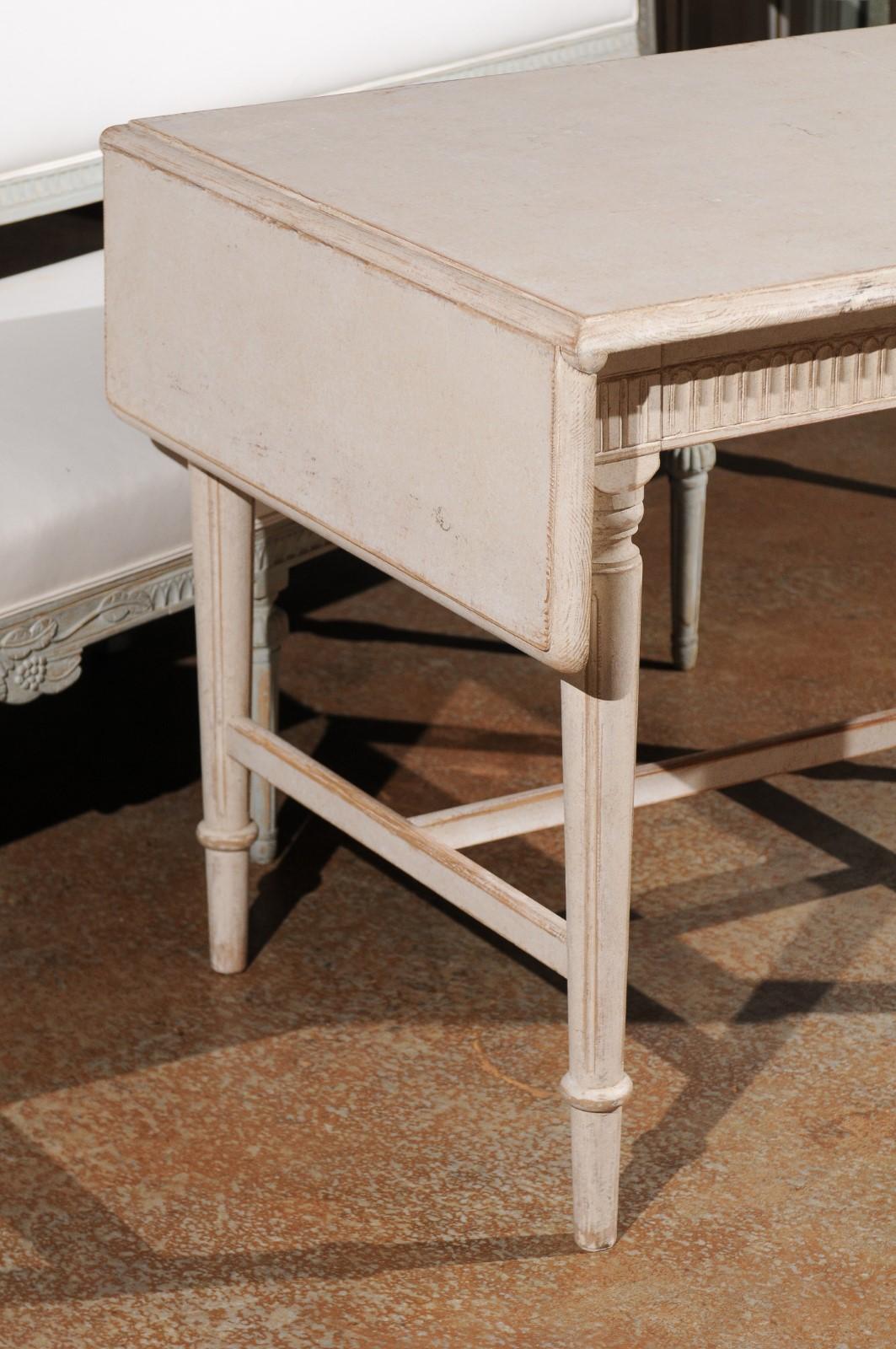 Swedish Neoclassical Style 1910s Painted Wood Drop-Leaf Table with Carved Décor In Good Condition In Atlanta, GA