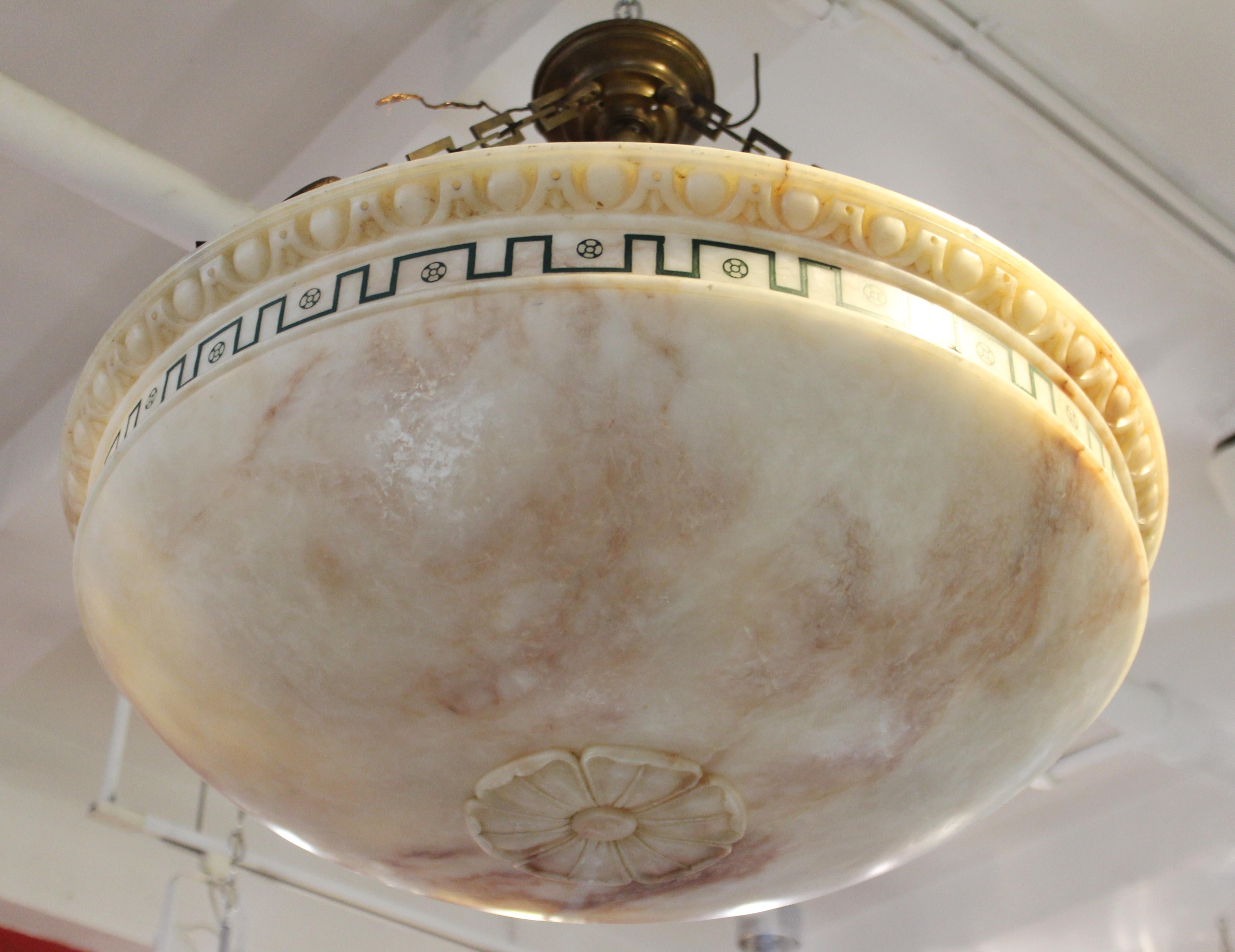 Swedish neoclassical revival style dome-shaped alabaster plafonnier pendant light. The piece has a decorative egg and dart relief border above a geometric border with black inlay, and has a carved rosette on the bottom tip. Likely made in Sweden