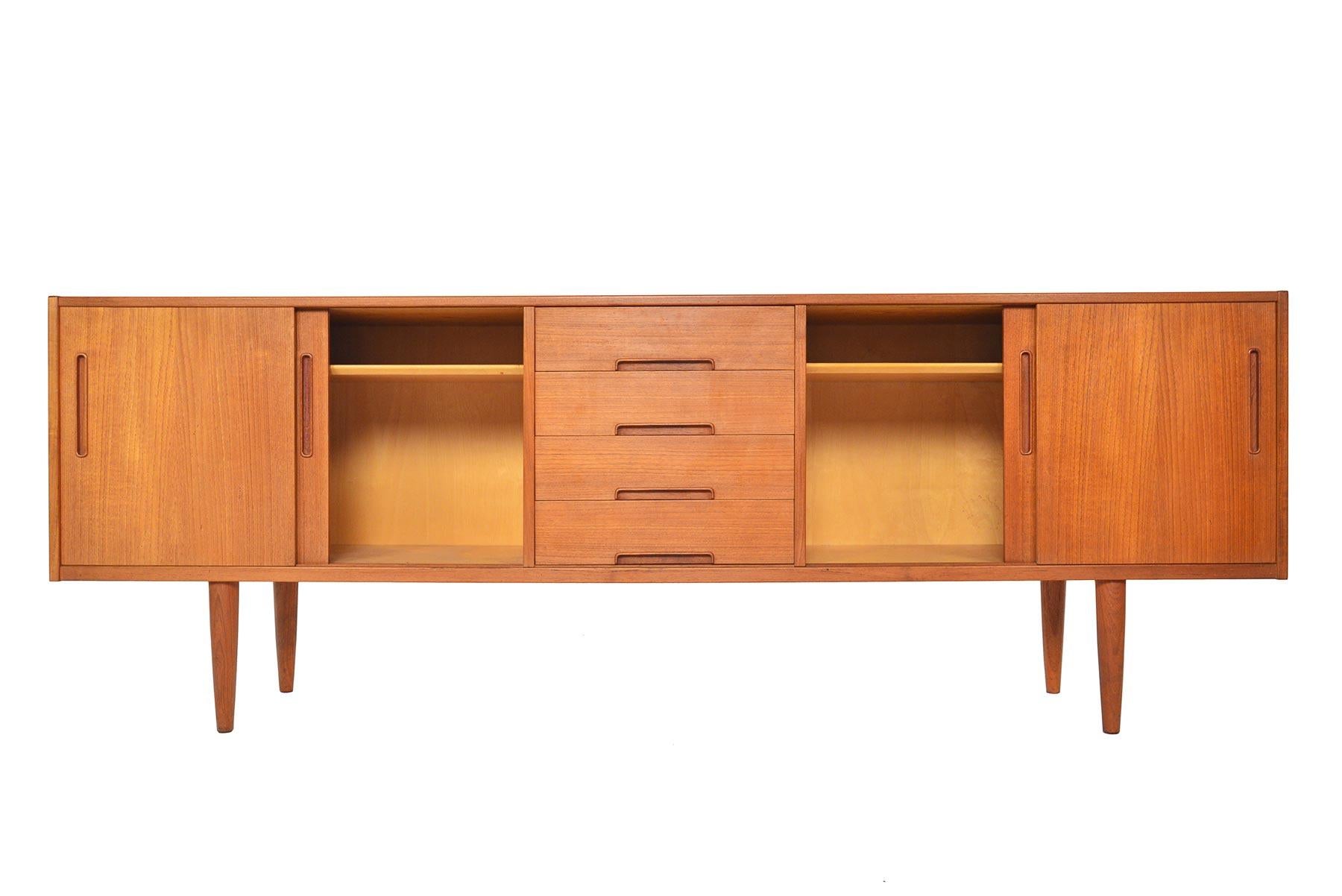 This breathtaking Swedish modern midcentury teak Gigante credenza was designed by Nils Jonsson and manufactured by Troeds in the 1960s. The perfect scale for any dining or living room, this piece will make a wonderful addition to your modern home.