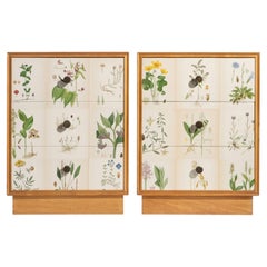 Swedish Nordens Flora Illustrations on Pair of Blonde Mahogany Nightstands