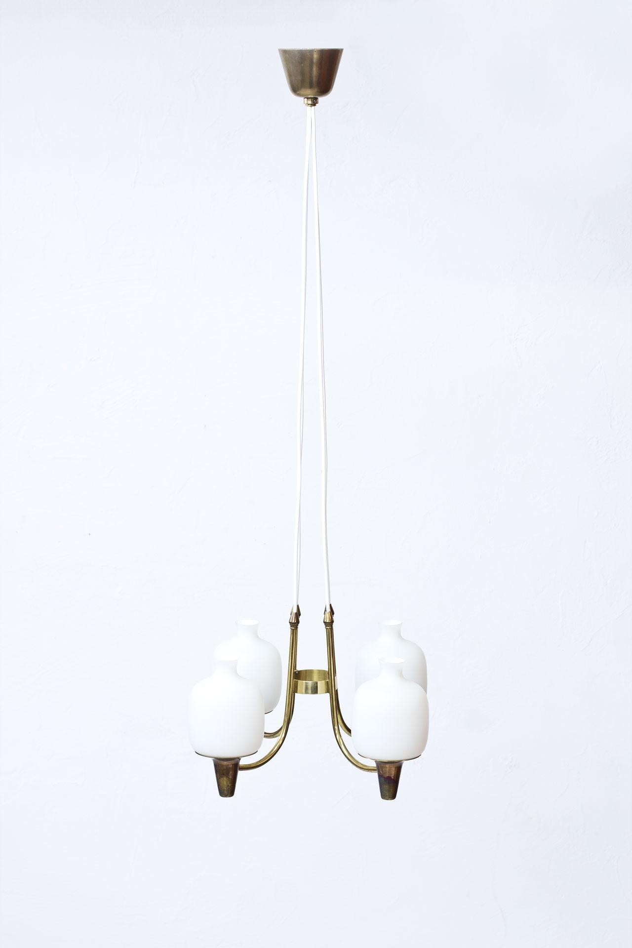 Ceiling lamp most likely manufactured in Sweden during the 1950s. Opaline glass diffusers with brass fittings. Rewired.