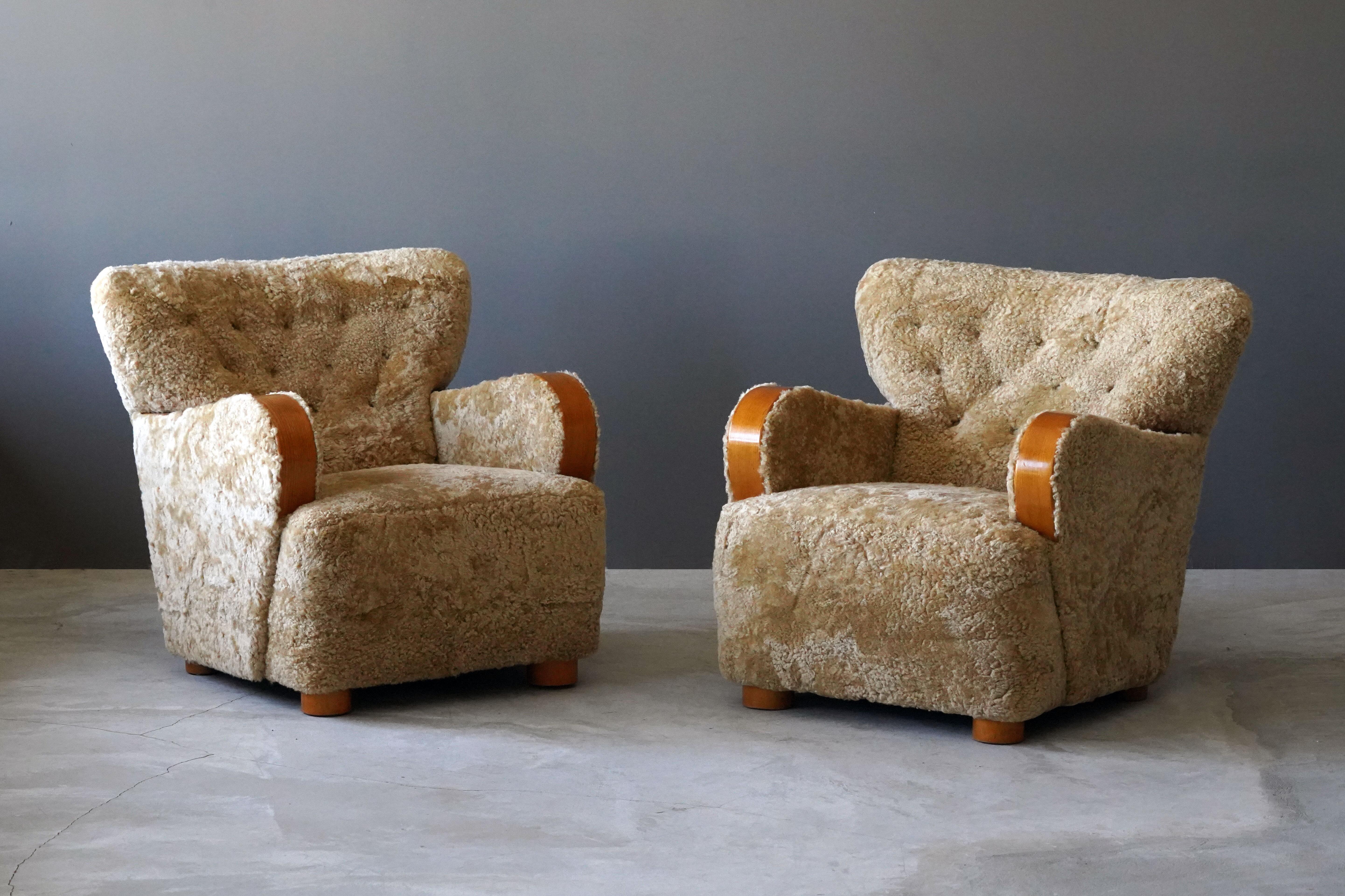 A pair of organic lounge chairs. Produced and designed in Sweden, 1930s. Fully restored. In beech and sheepskin.

Other designers of the period include Flemming Lassen, Philip Arctander, Viggo Boesen, Jean Royère, and Gio Ponti.
