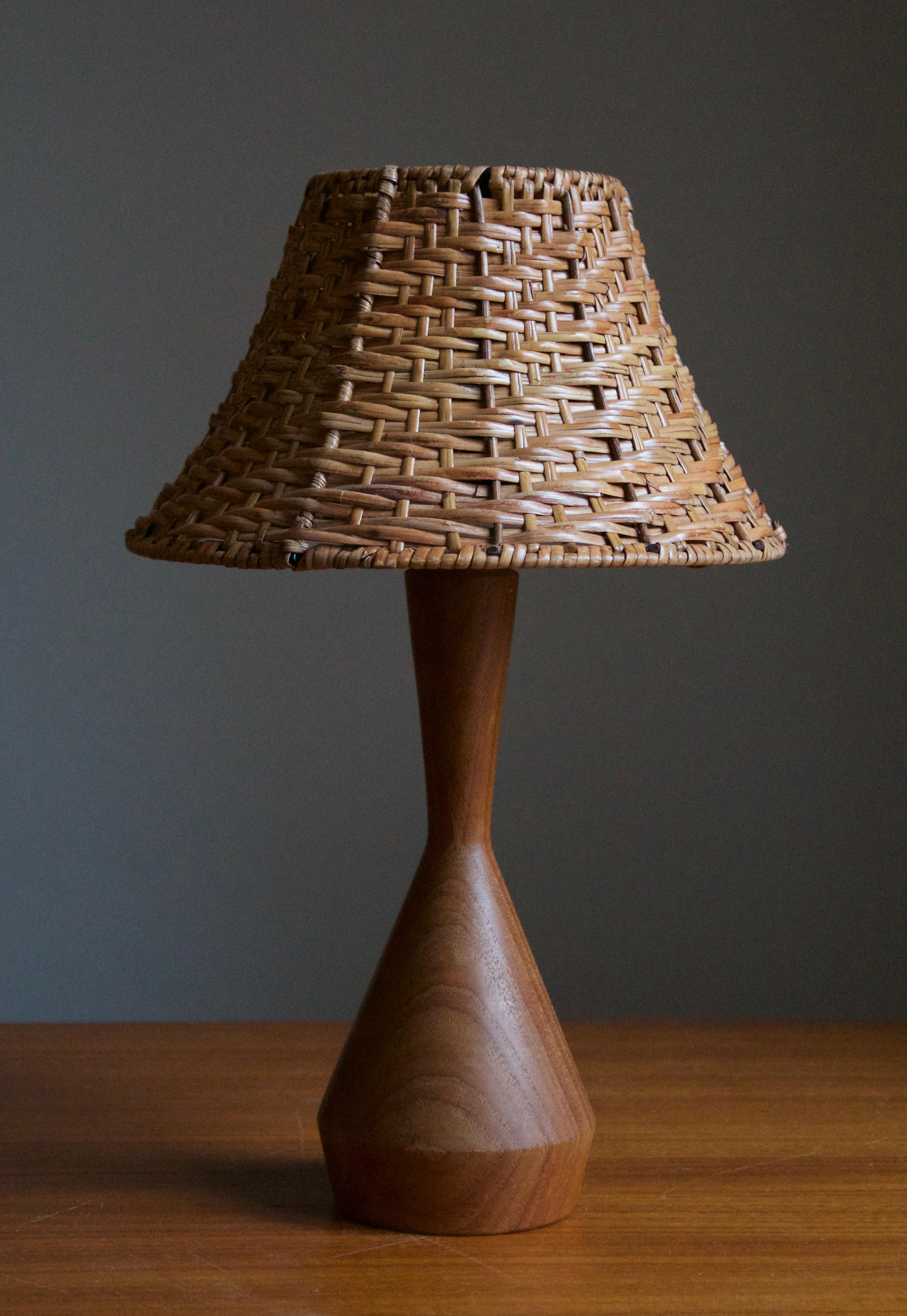 A table lamp designed and produced in Sweden in, c. 1960s.

Stated dimensions exclude lampshade, height includes the socket, excludes harp. Assorted vintage lampshade can be included in purchase upon request.
