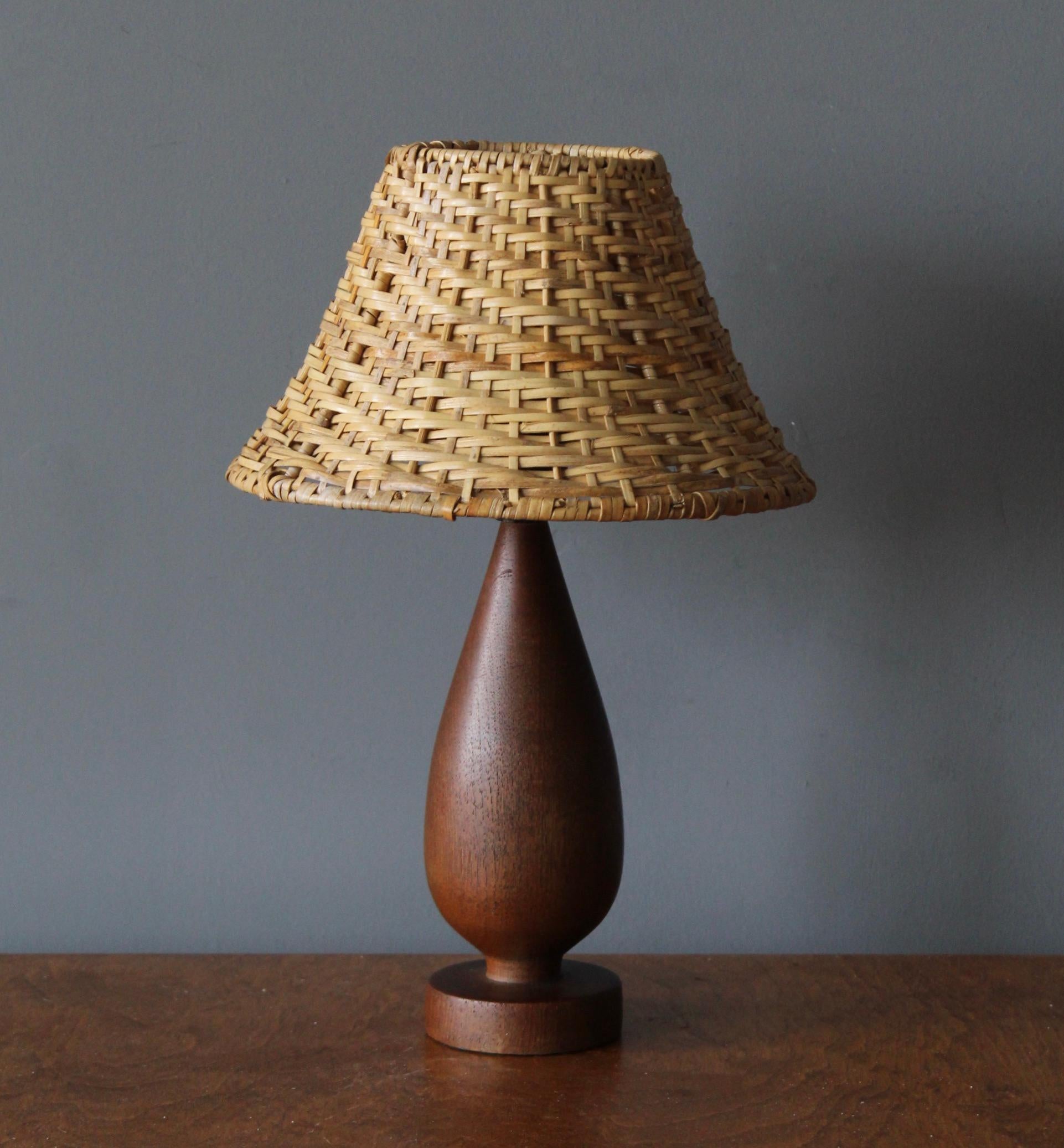 A table lamp designed and produced in Sweden in, c. 1960s.

Stated dimensions include lampshade. Assorted vintage lampshade can be included in purchase upon request.