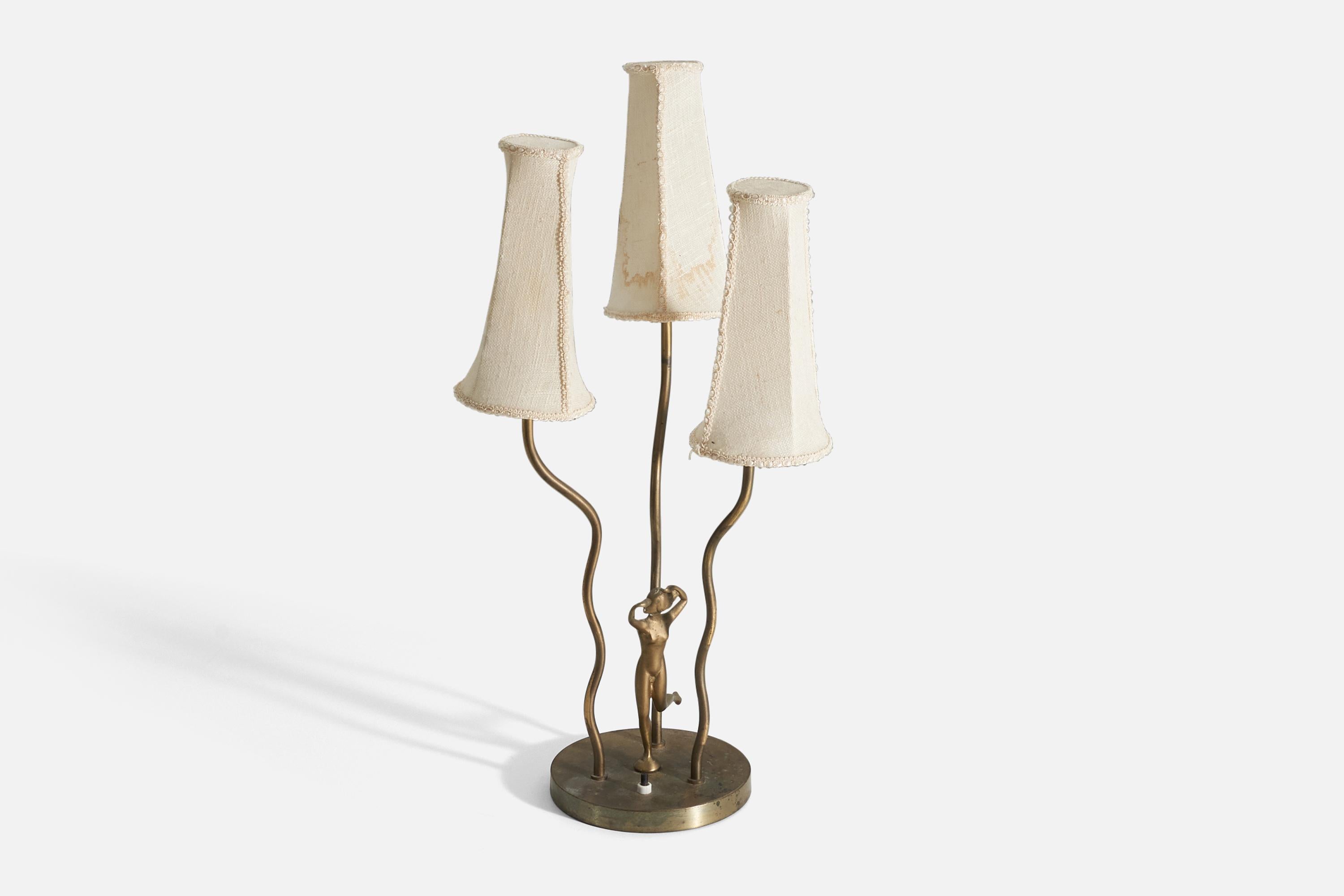 A table lamp, designed and produced in Sweden, 1940s. Features three organic arms. Ornamental sculpture attached to base. Vintage lampshades 

Other designers of the period include Paavo Tynell, Alvar Aalto, Josef Frank, and Lisa Johansson-Pape.