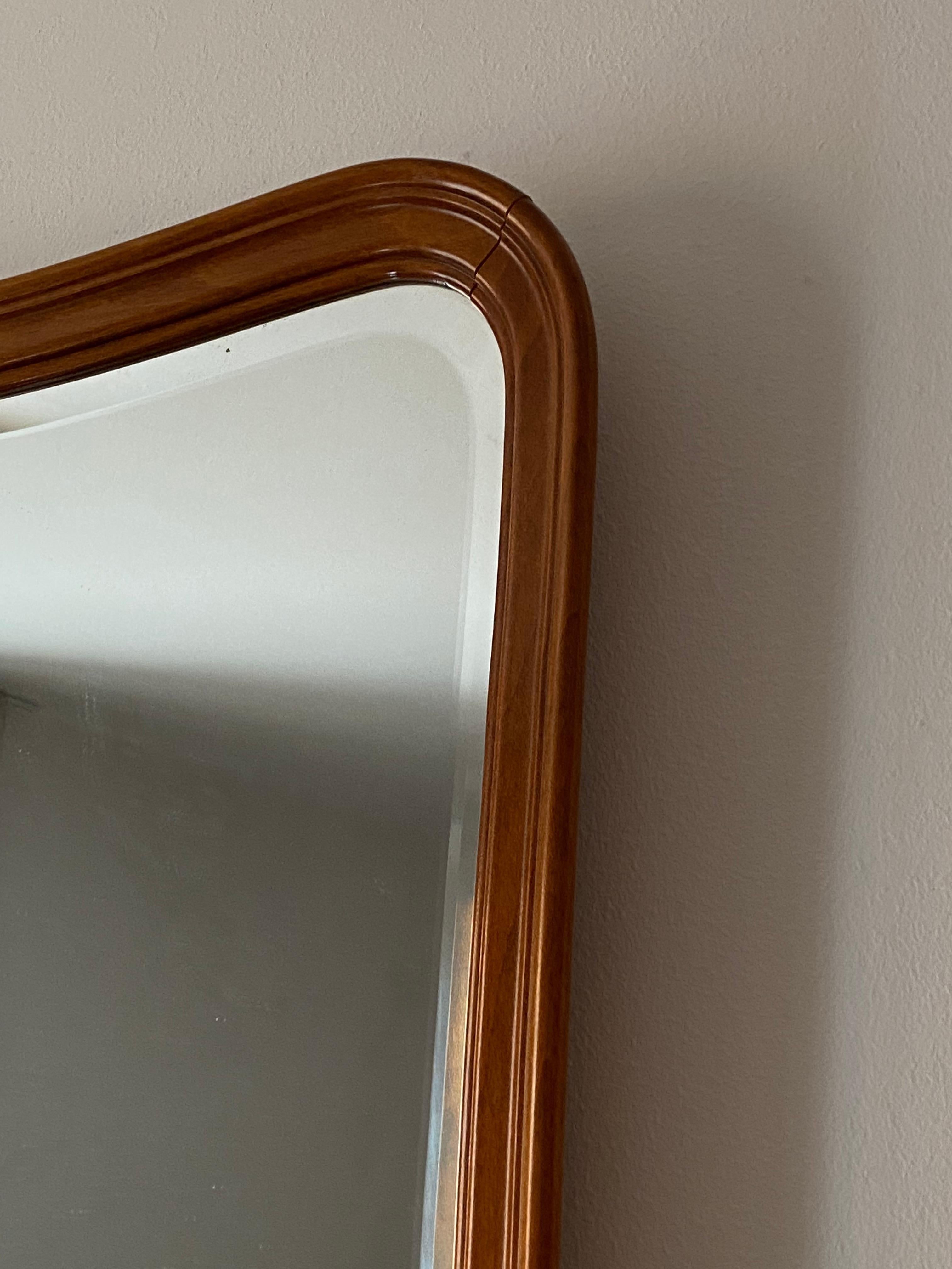 An organic wall mirror. Designed and produced in Sweden, c. 1950s. Features finely ornamented carved wood, and it's original mirror glass.

Other designers of the period include Paolo Buffa, Fontana Arte, Jean Royère, Josef Frank, and Gio Ponti.