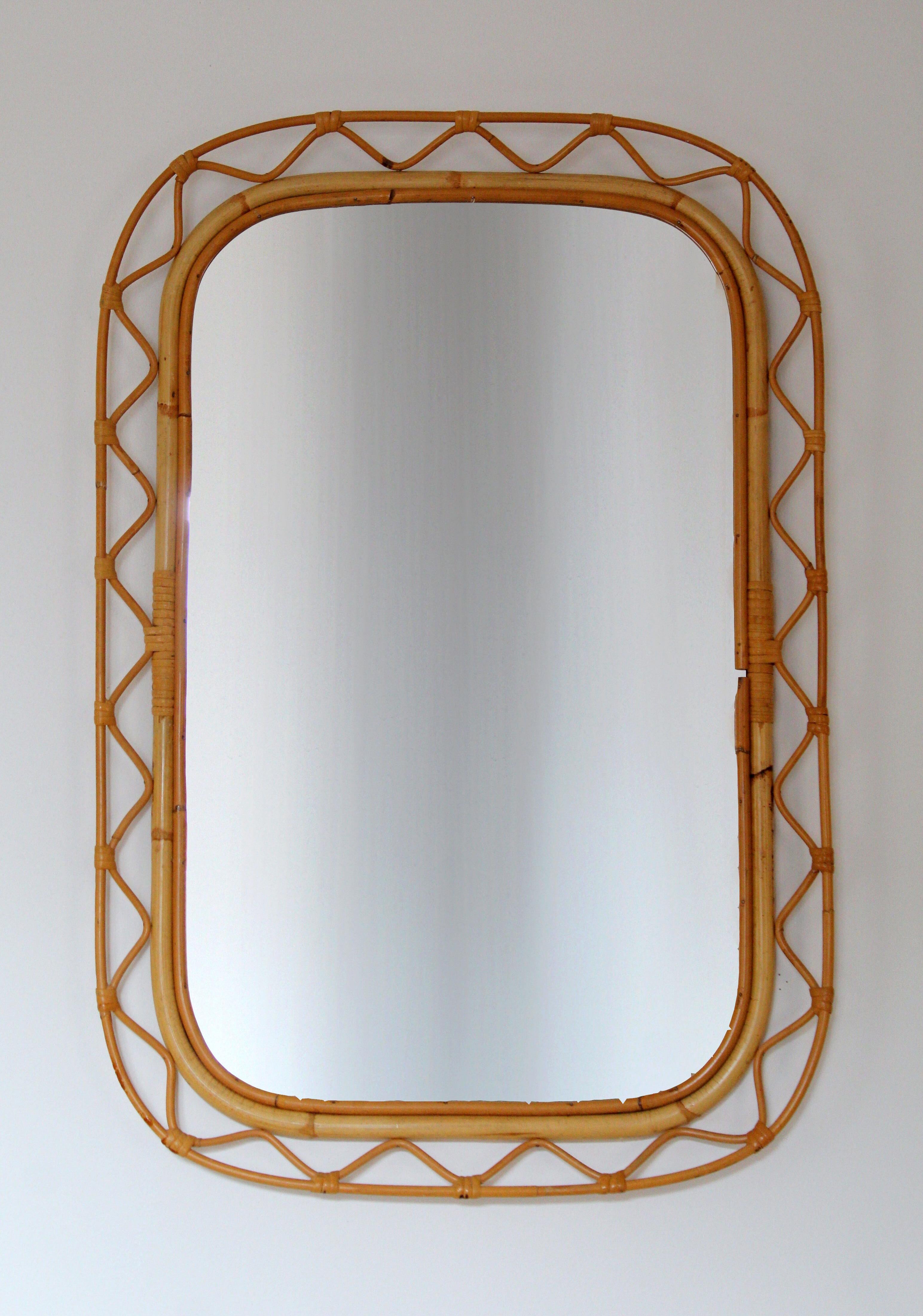 An organic mirror, of unknown Swedish production. Similar mirrors retailed by Svenskt Tenn, the iconic Swedish firm founded by Estrid Ericson and creatively led by Josef Frank. 

In finely braided wicker / rattan / cane and bambo.

Other
